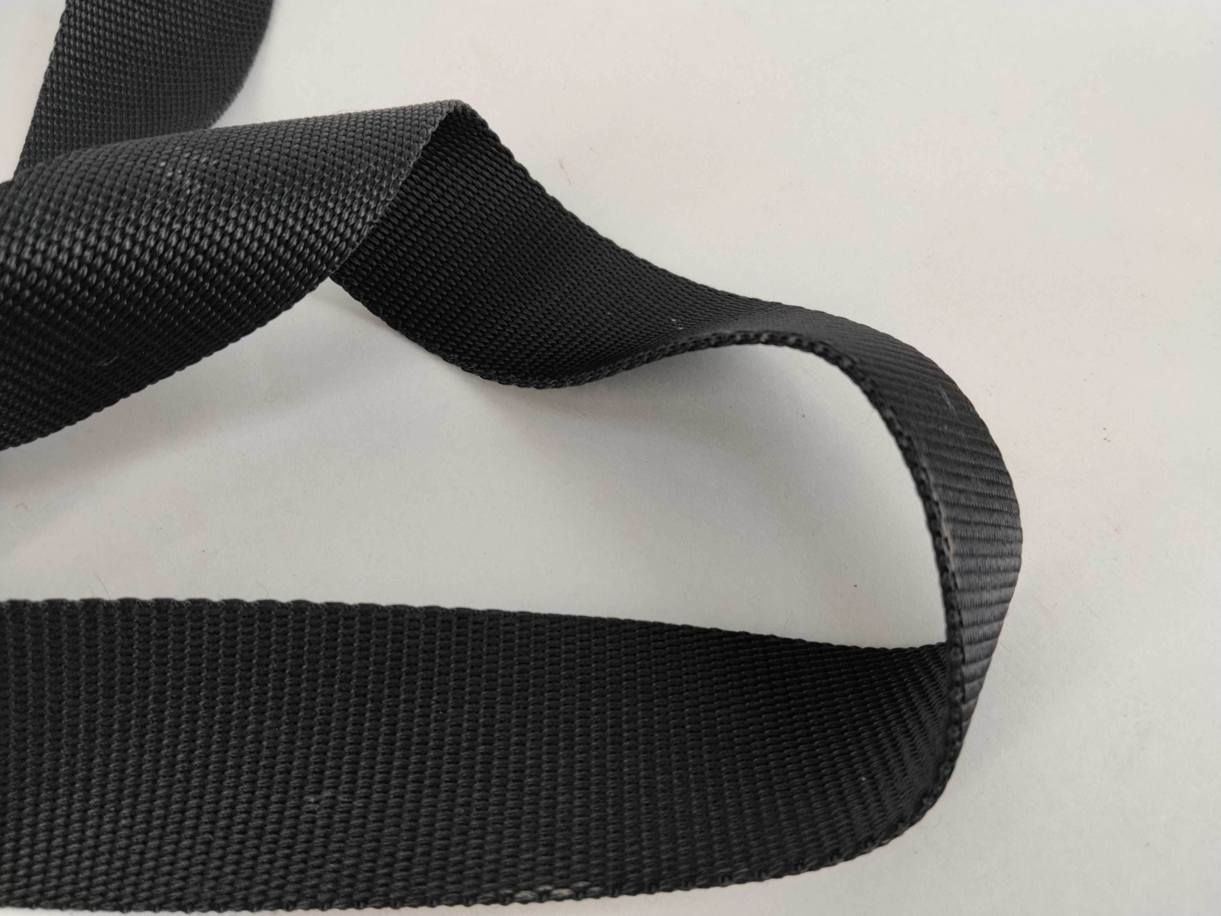 nylon shoulder bag with triangular logo plate, black nylon, white tag, and dust bag. — view 4