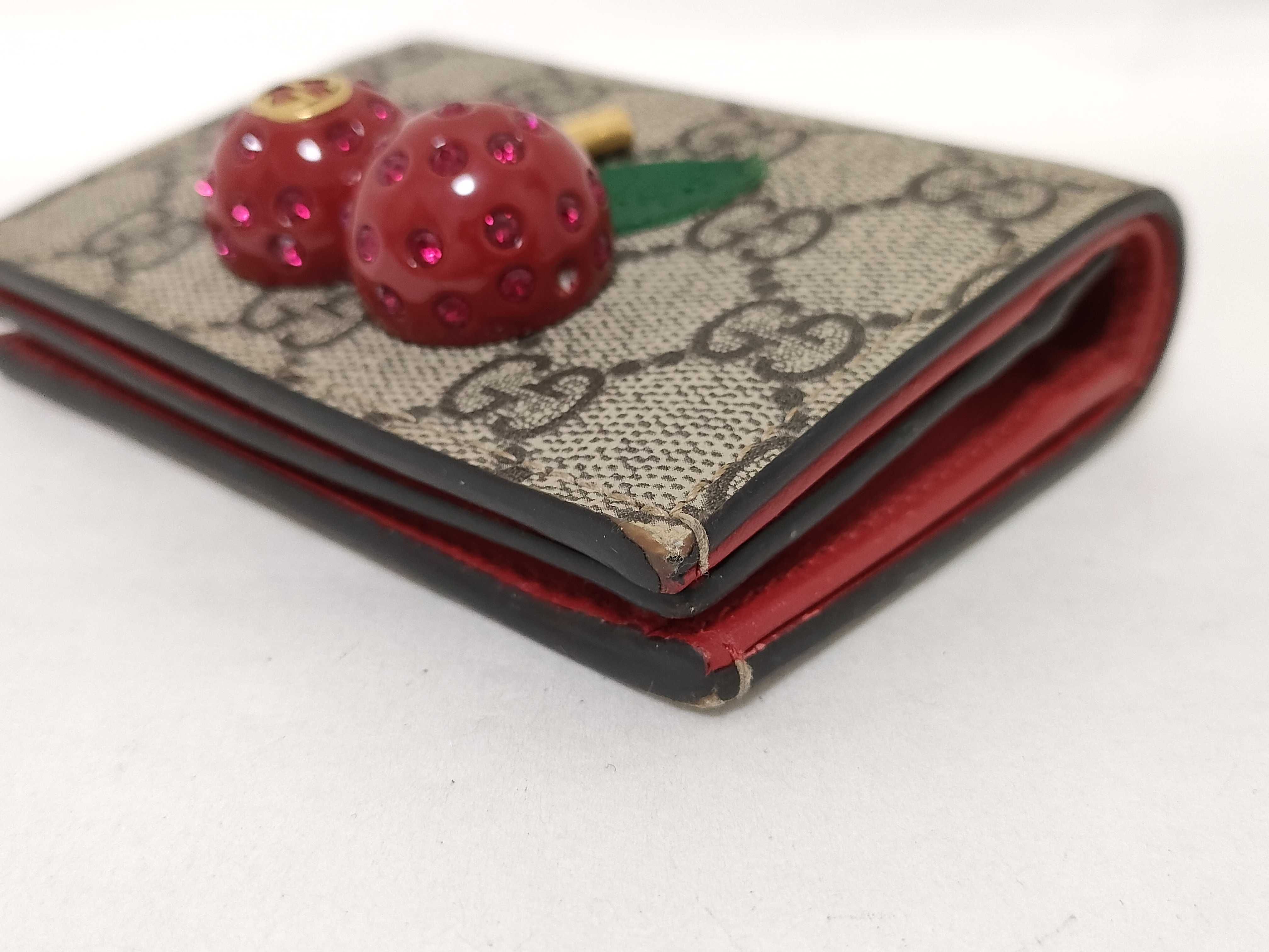 GG Supreme Bi-fold Wallet (476050/525040) - Interlocking G pattern, PVC, Cherry color, Brown tones. Includes box and dust bag. — view 4