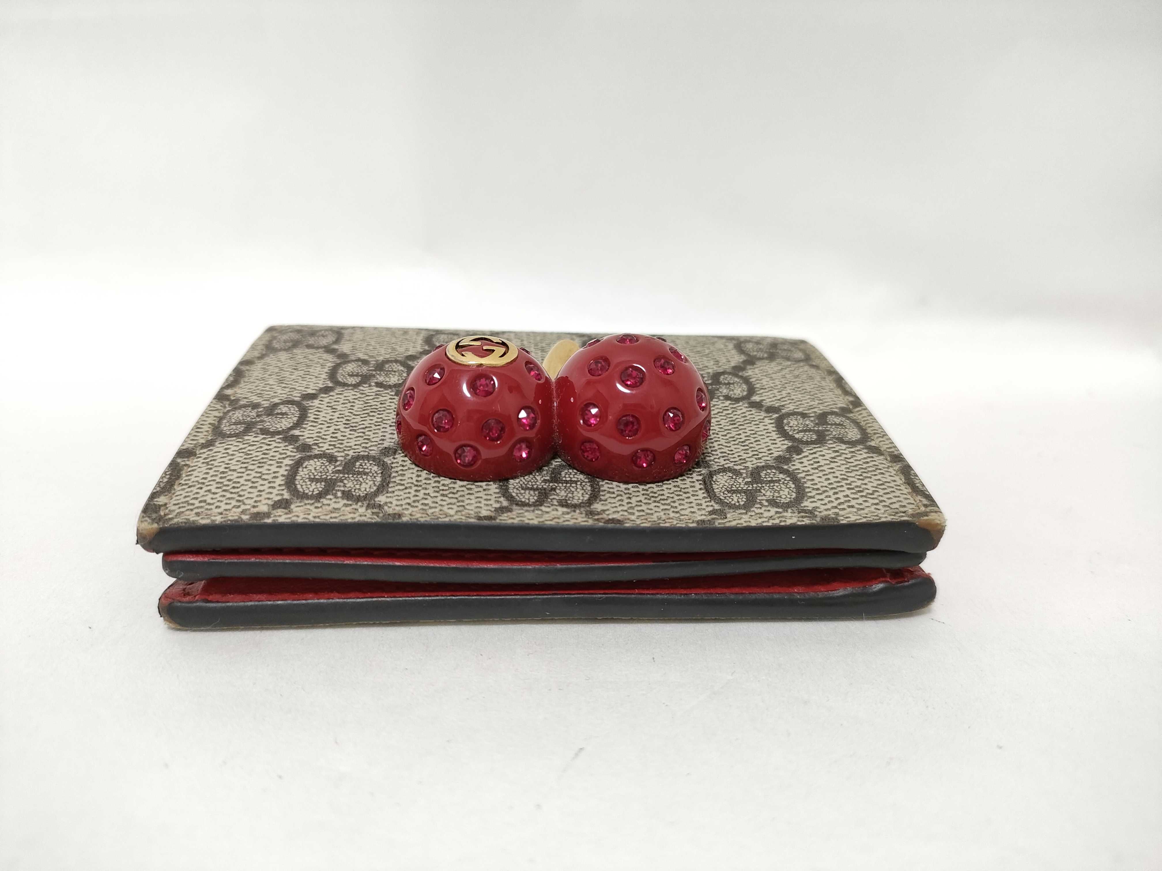 GG Supreme Bi-fold Wallet (476050/525040) - Interlocking G pattern, PVC, Cherry color, Brown tones. Includes box and dust bag. — view 5
