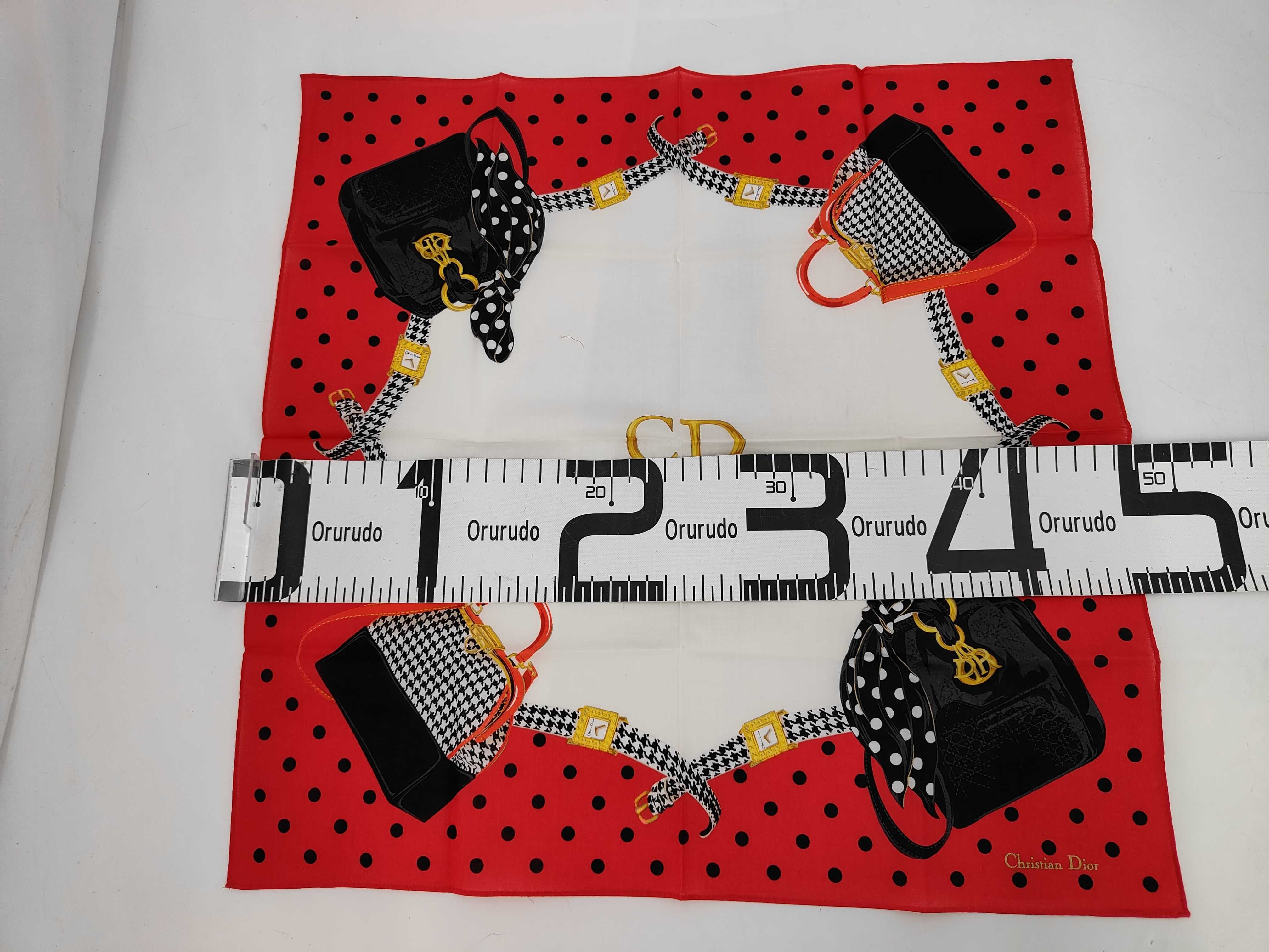 handkerchief scarf with CD logo, bag motif, houndstooth pattern, watch, polka dots, and other accessories. — view 2