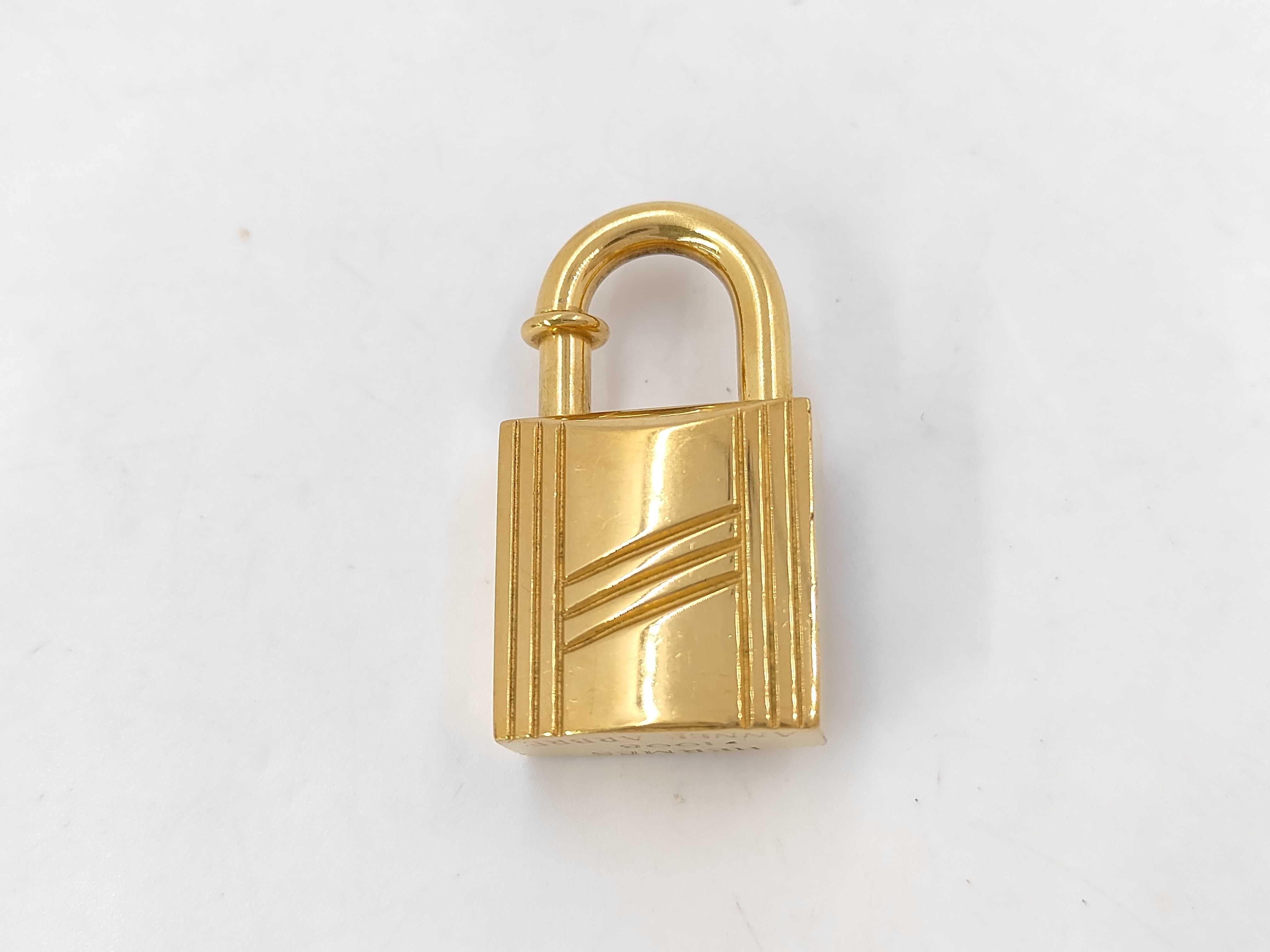 padlock charm, gold, and other accessories. — view 2