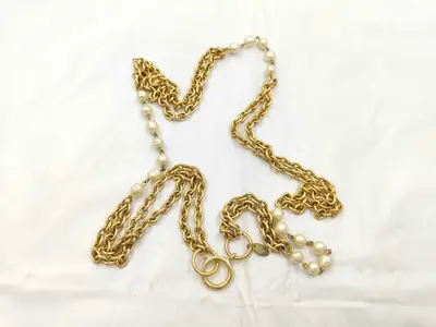 belt with box, gold and pearl, and other accessories.