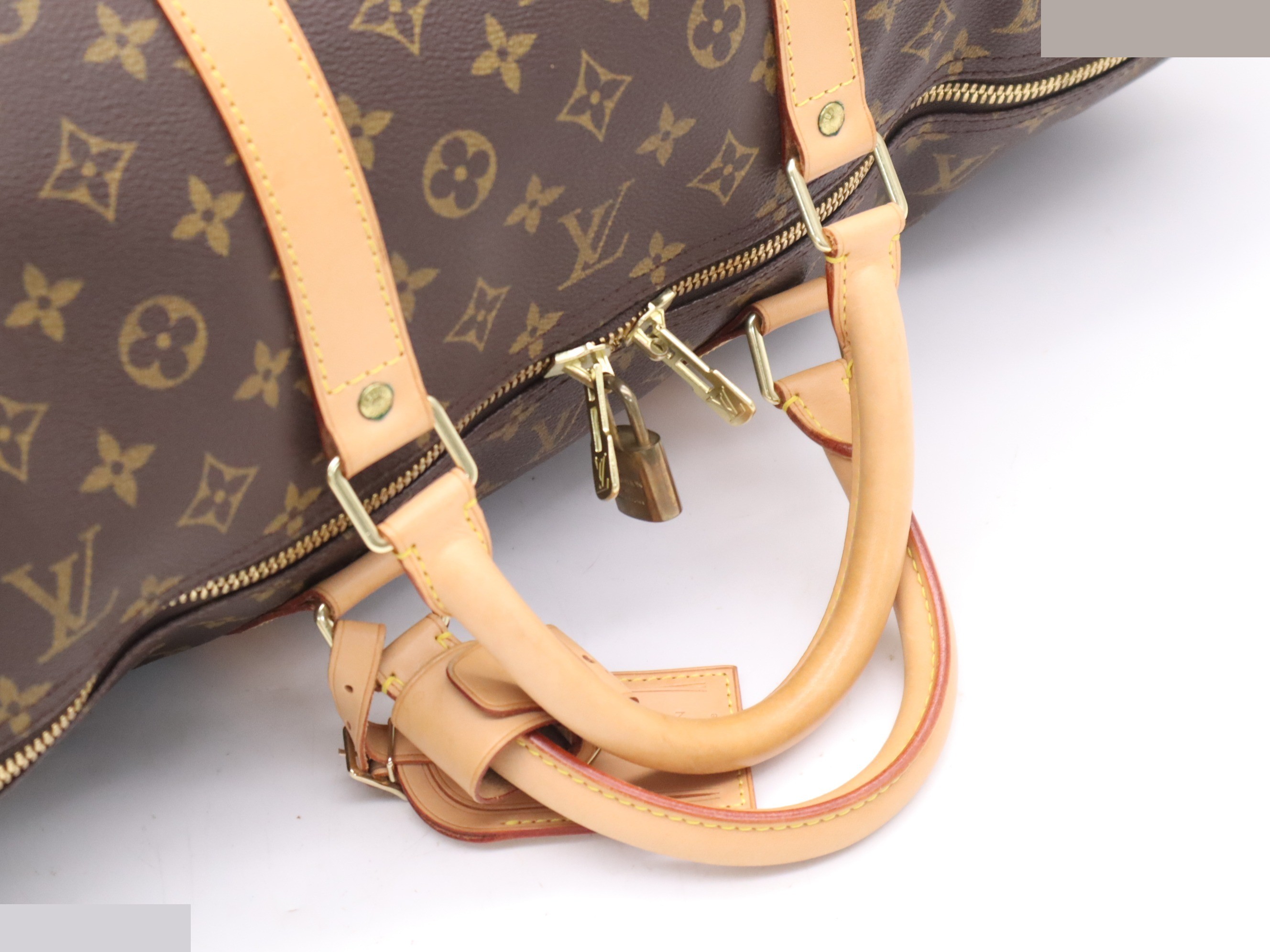 Keepall 60 with padlock, name tag, handle strap, and dust bag. — view 6