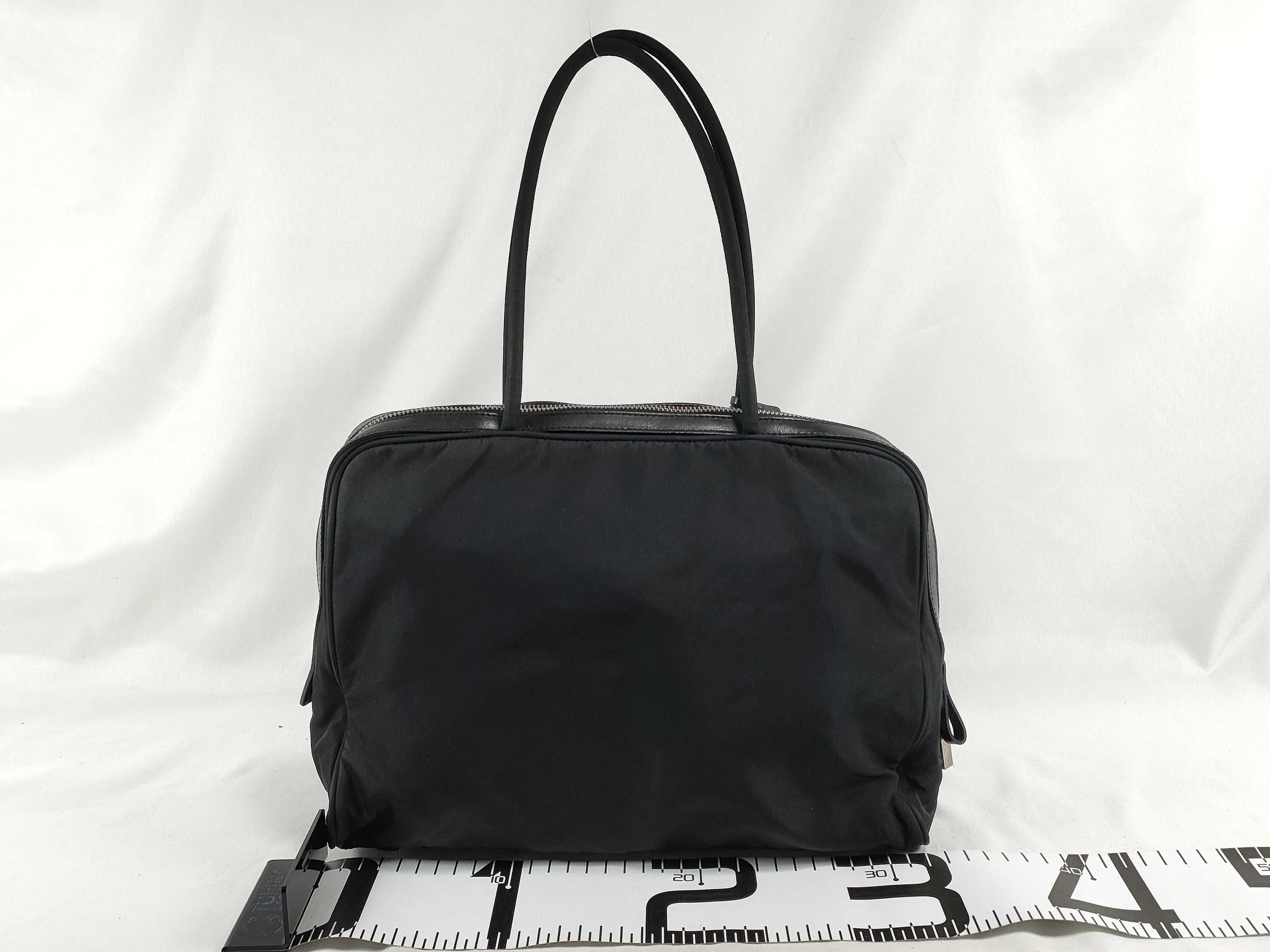 nylon leather handbag, black, serial number, padlock, key. — view 2