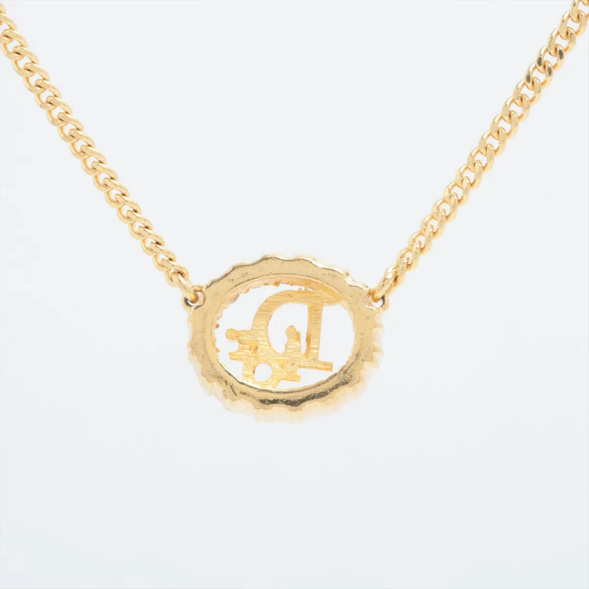 CD logo necklace, gold plated with rhinestones. Shows signs of wear, — view 2