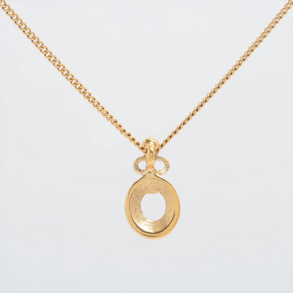 CD logo necklace, gold plated with rhinestones. Shows signs of wear, — view 2