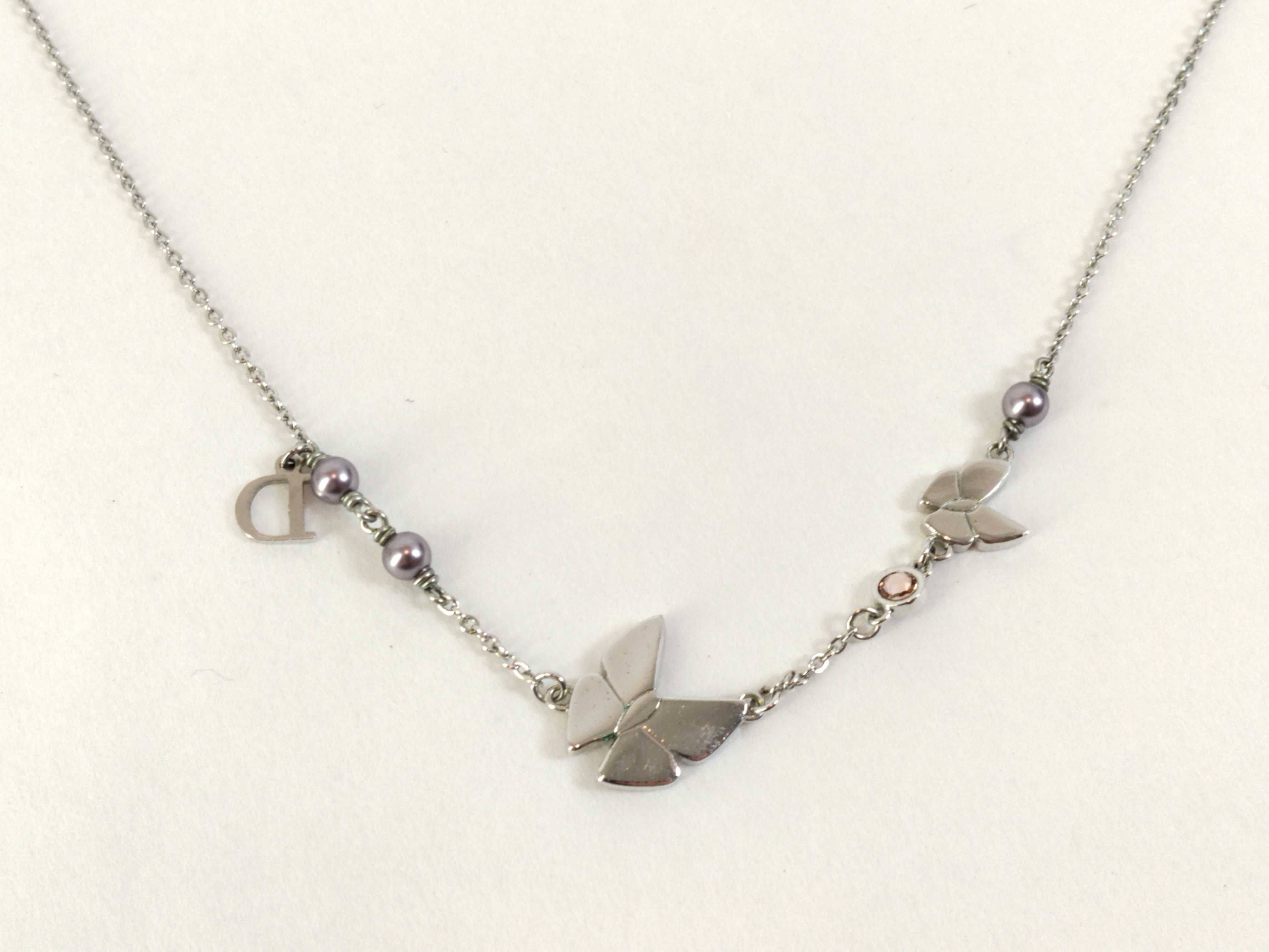 silver-colored butterfly motif necklace — view 2
