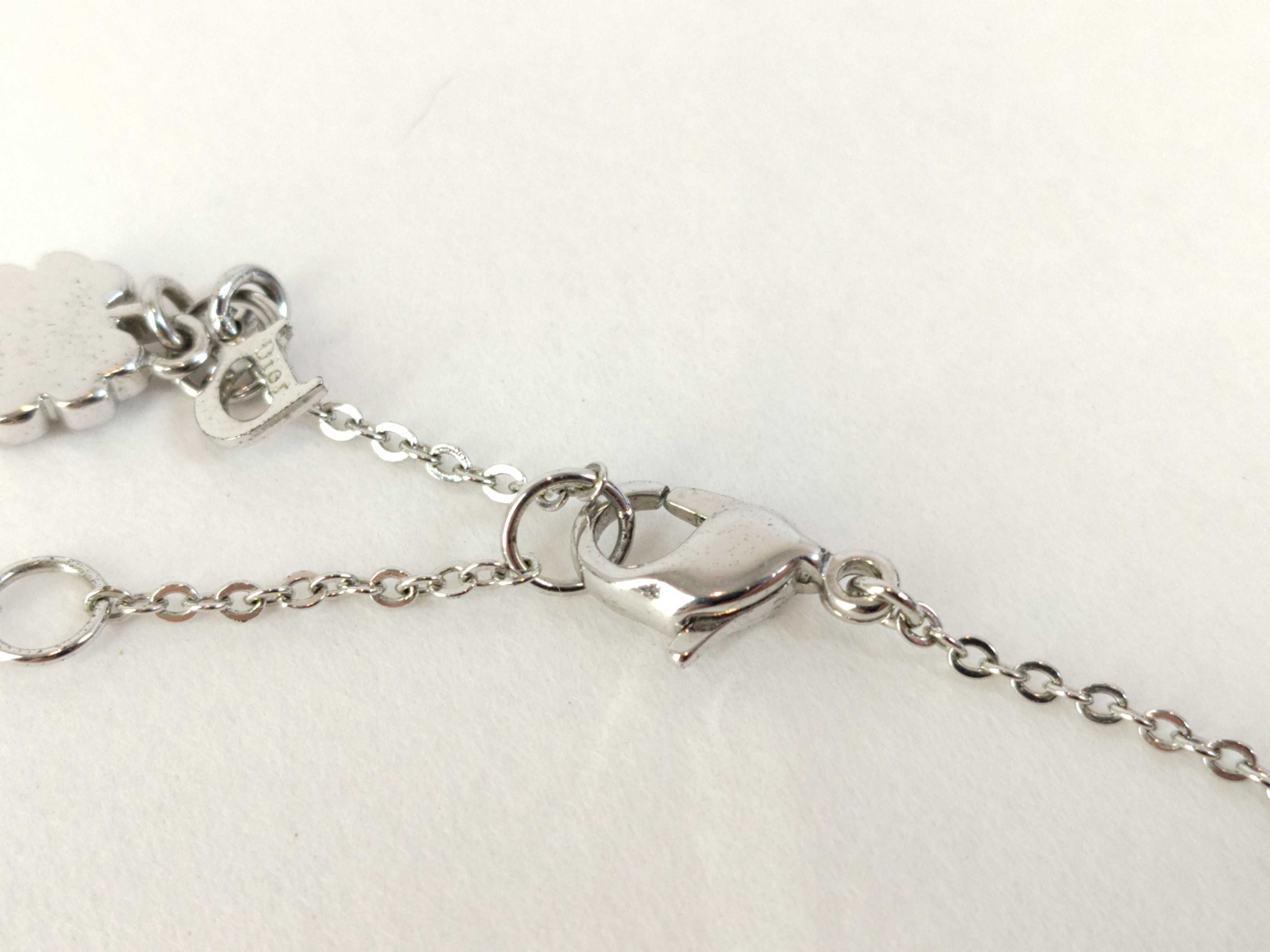 silver-colored butterfly motif necklace — view 3
