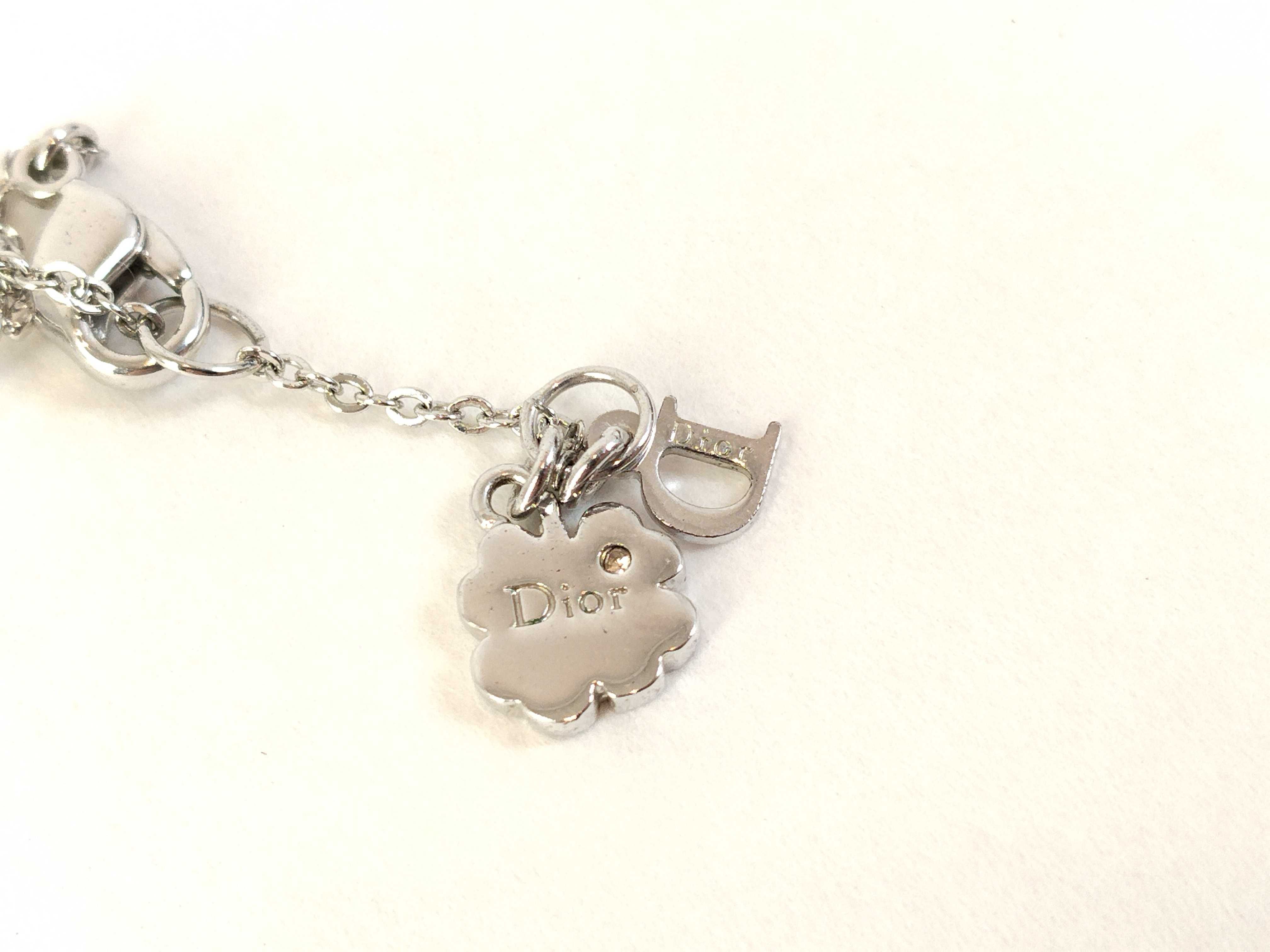 silver-colored butterfly motif necklace — view 4