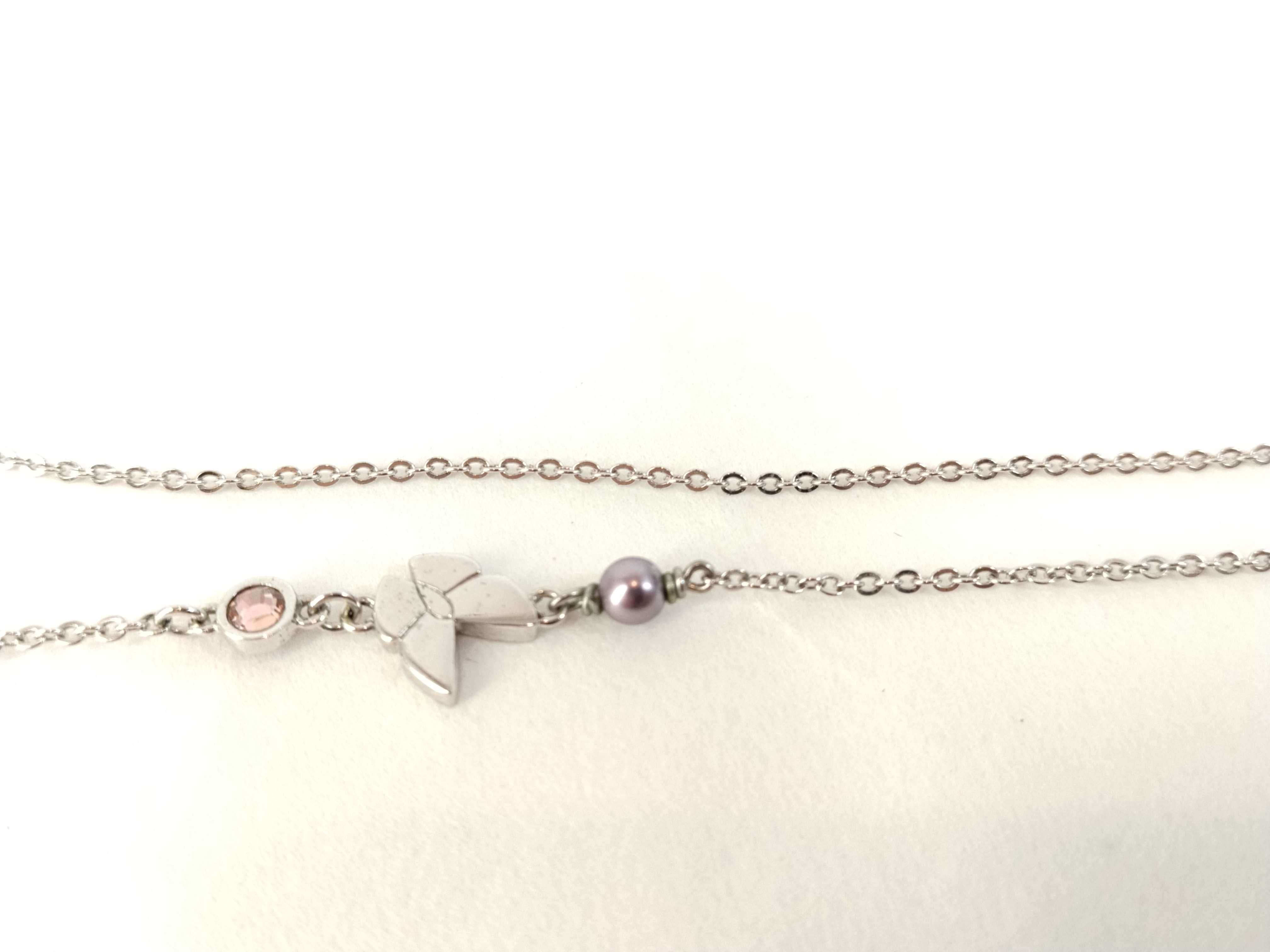 silver-colored butterfly motif necklace — view 8