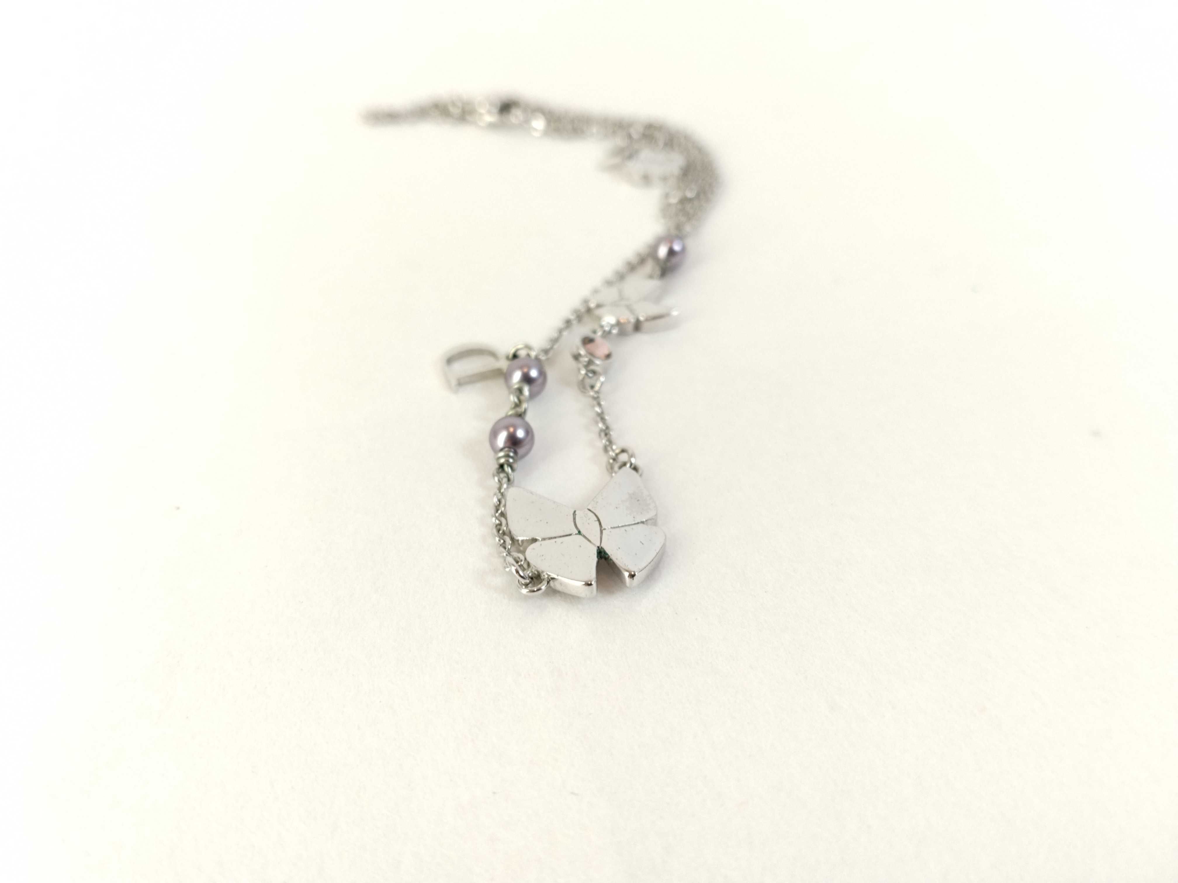 silver-colored butterfly motif necklace — view 10