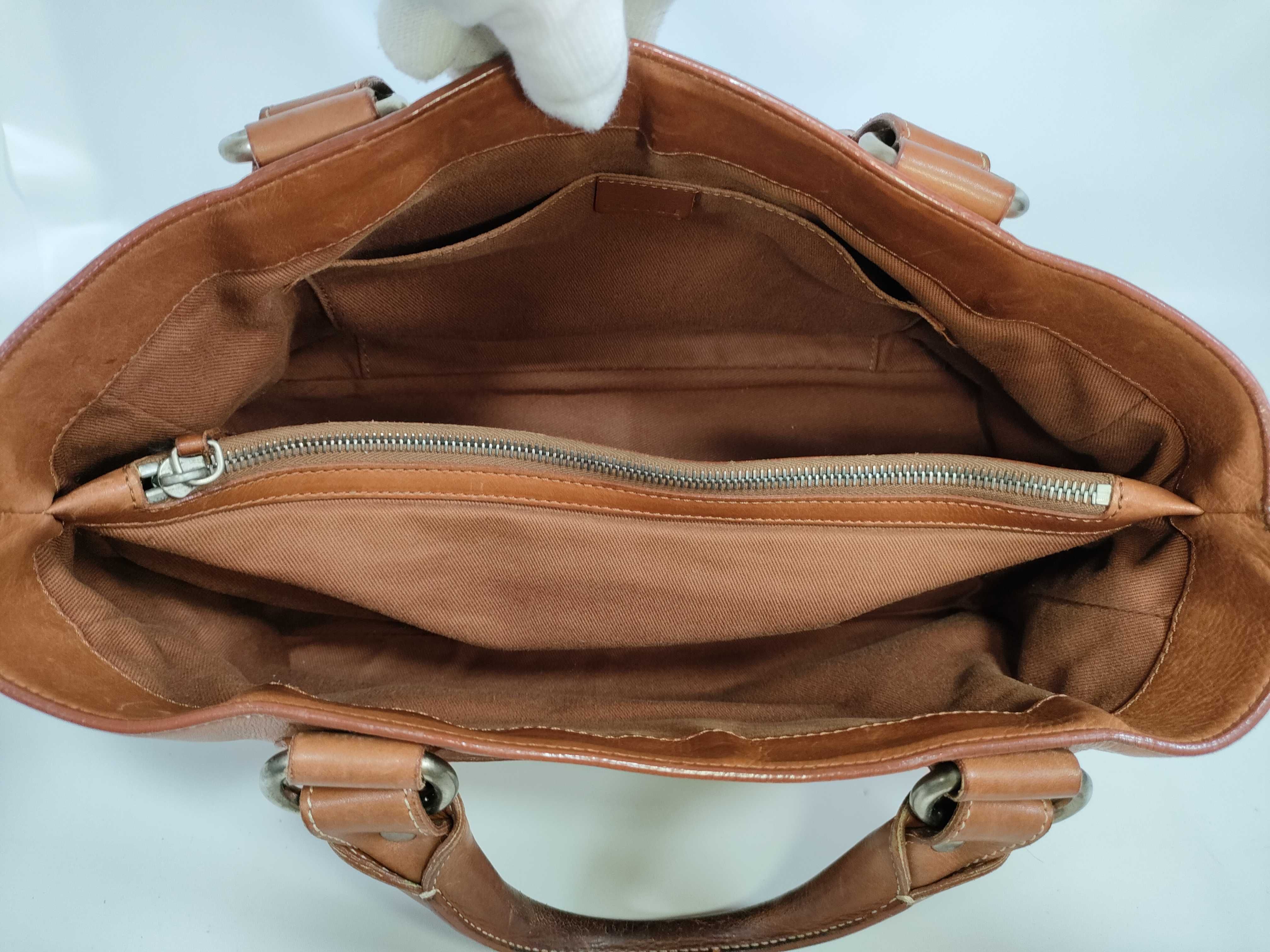 brown handbag — view 14
