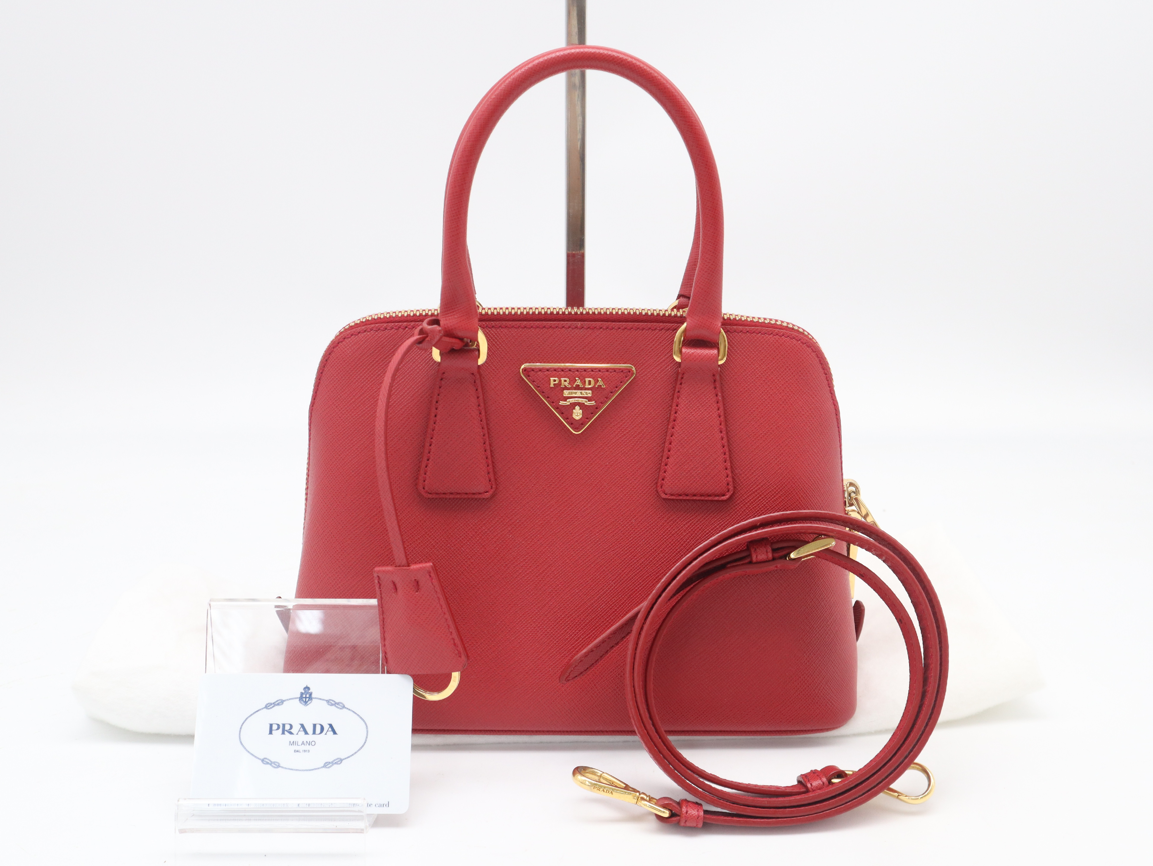 1BA838 Saffiano Leather 2-Way Handbag, Red, with Strap, Clochette, and Dust Bag.