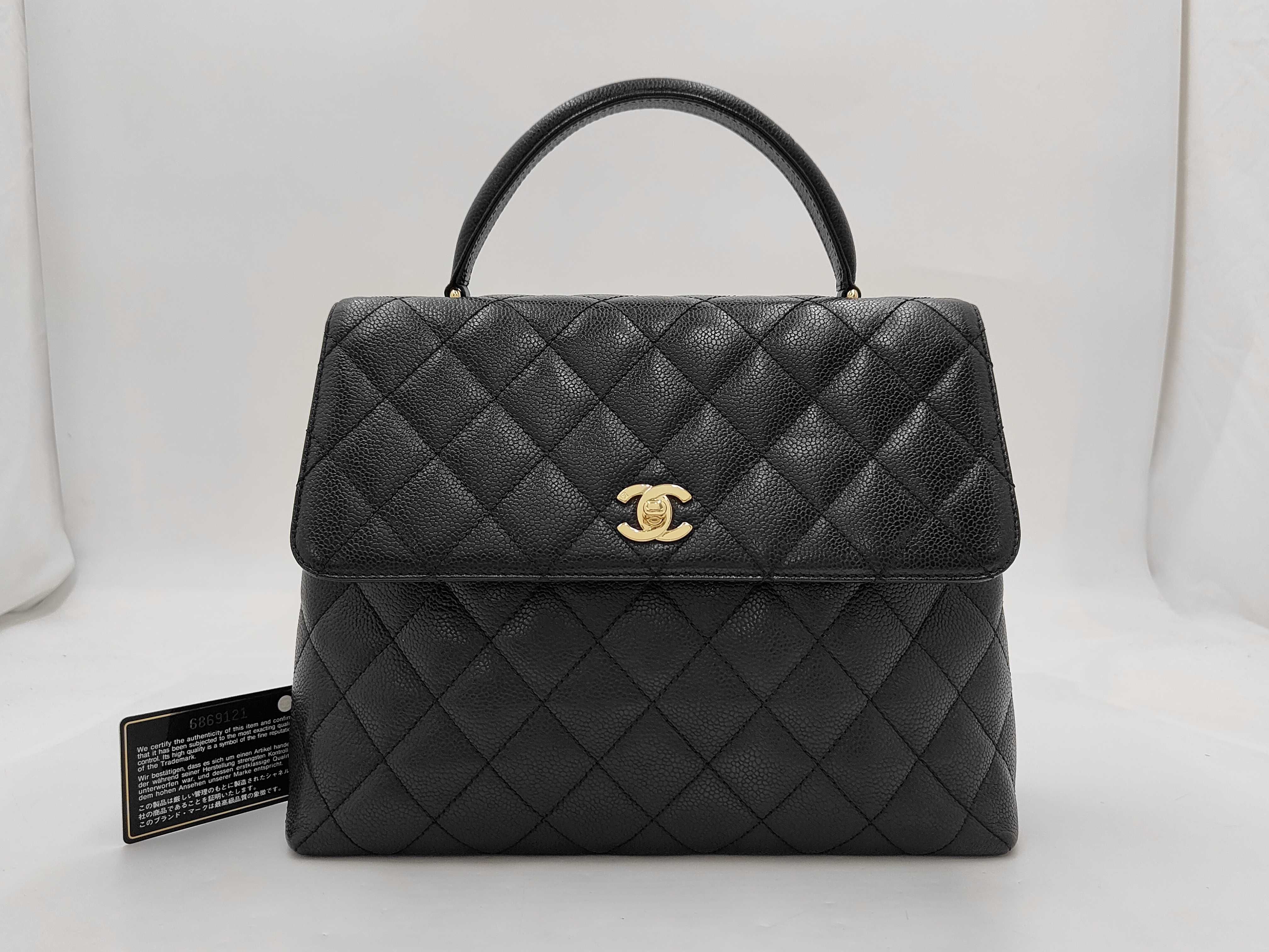 Matelassé Caviar Leather Top Handle Handbag, Black, with Authenticity Card and Seal.