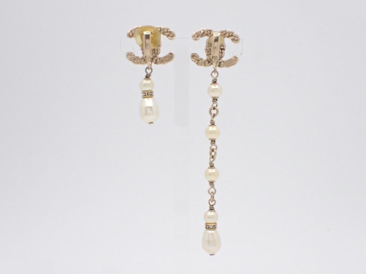 Asymmetrical earrings featuring the Coco Mark logo. — view 2
