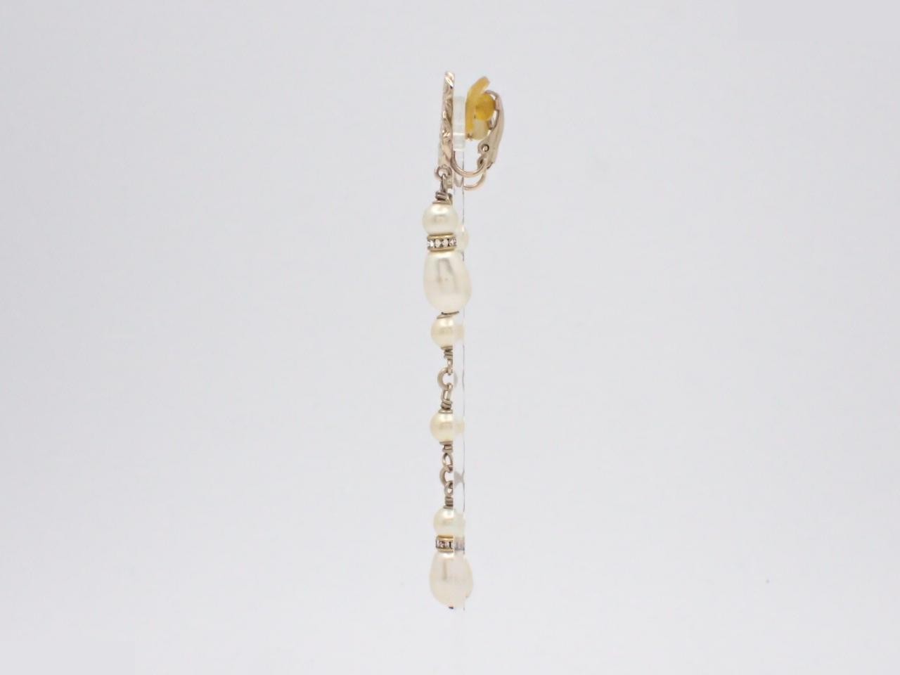 Asymmetrical earrings featuring the Coco Mark logo. — view 3