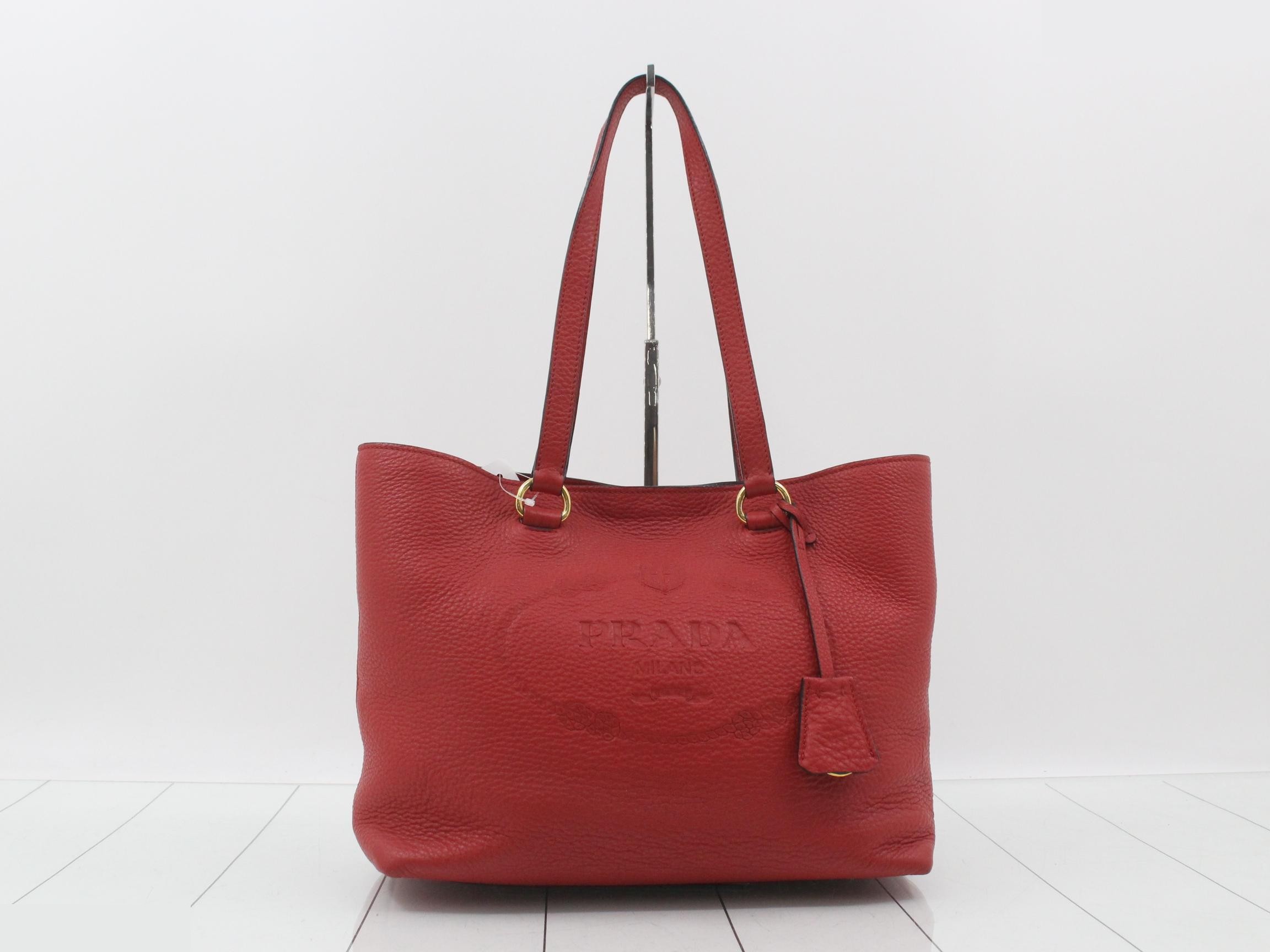 Logo embossed leather tote bag