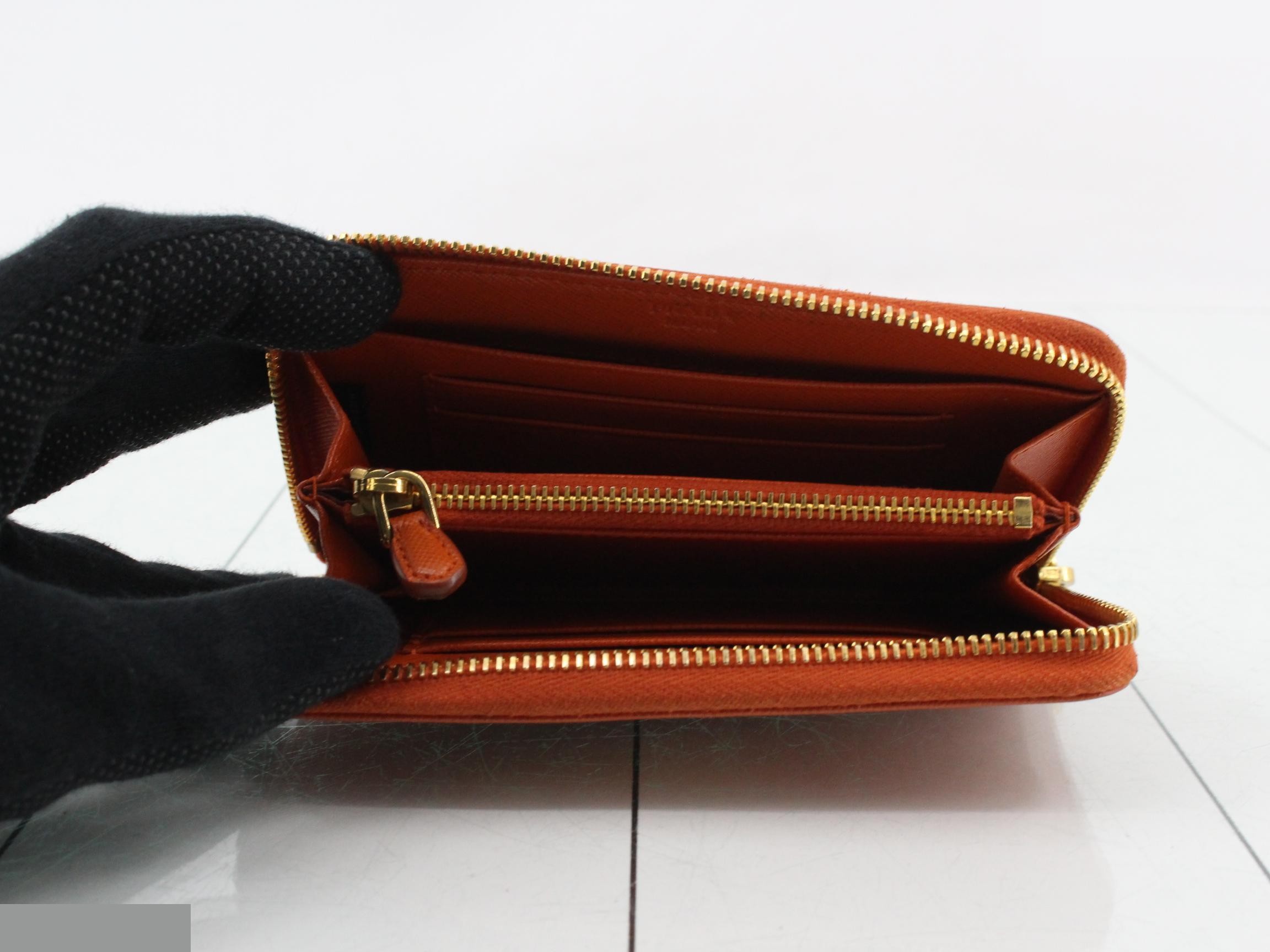 Saffiano leather, round zipper, medium-length wallet, gold hardware, with warranty card, half tag, and box. — view 4