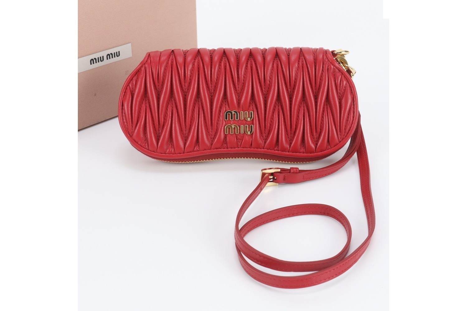 Matelassé leather pouch/clutch with shoulder strap