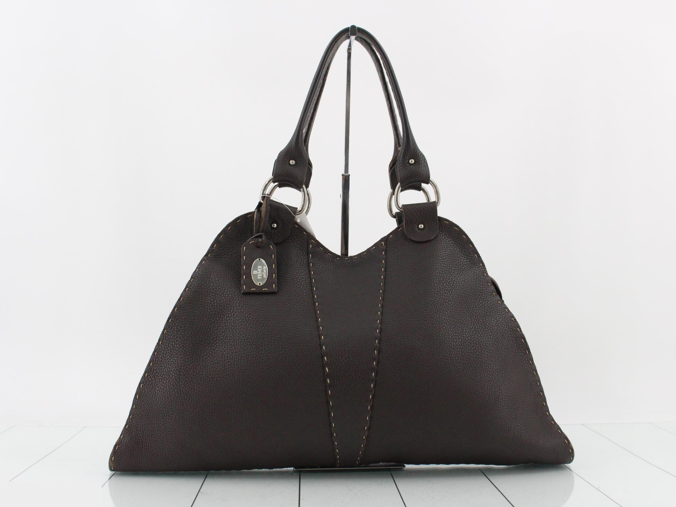 Leather tote bag, brown, with charm.