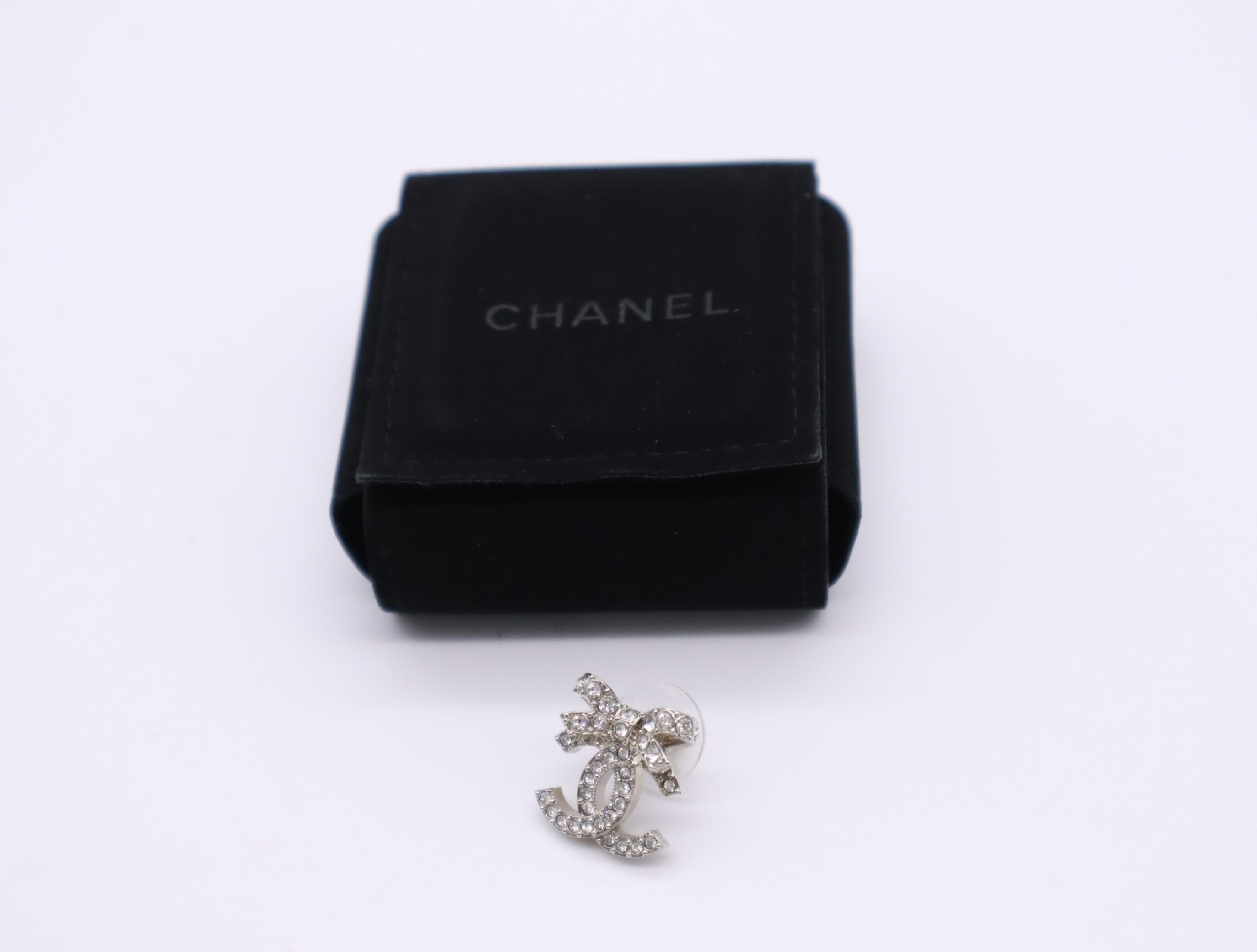 Metal x Rhinestone Coco Mark Ribbon Earrings, Silver Earrings