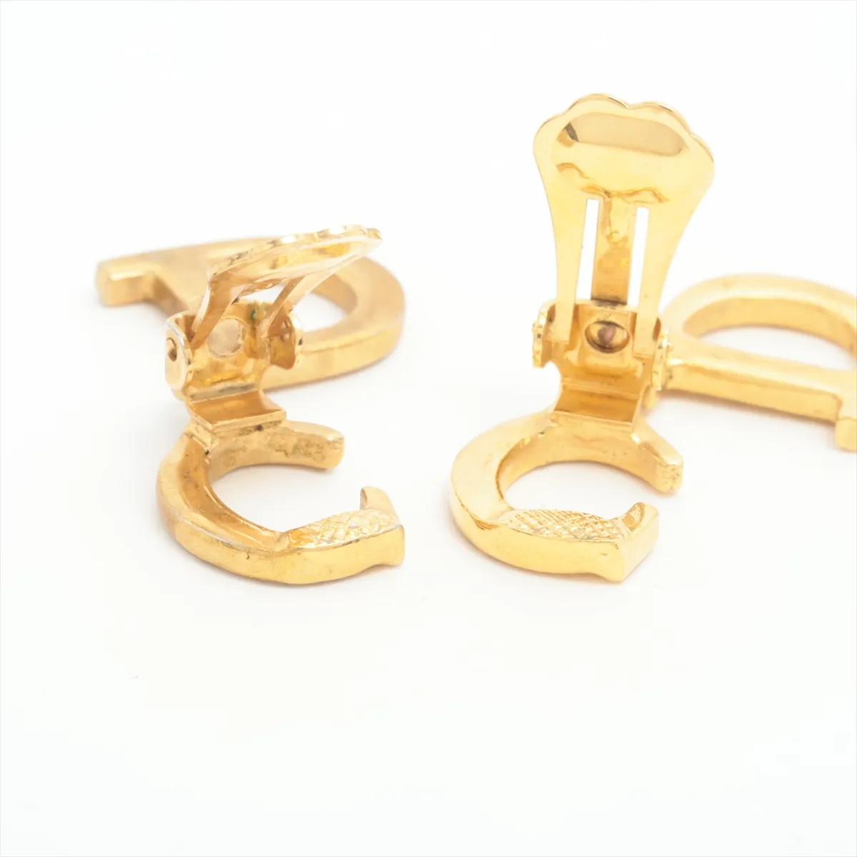 CD logo earrings (for both ears), gold-plated with rhinestones. Shows signs of wear including dents, — view 4