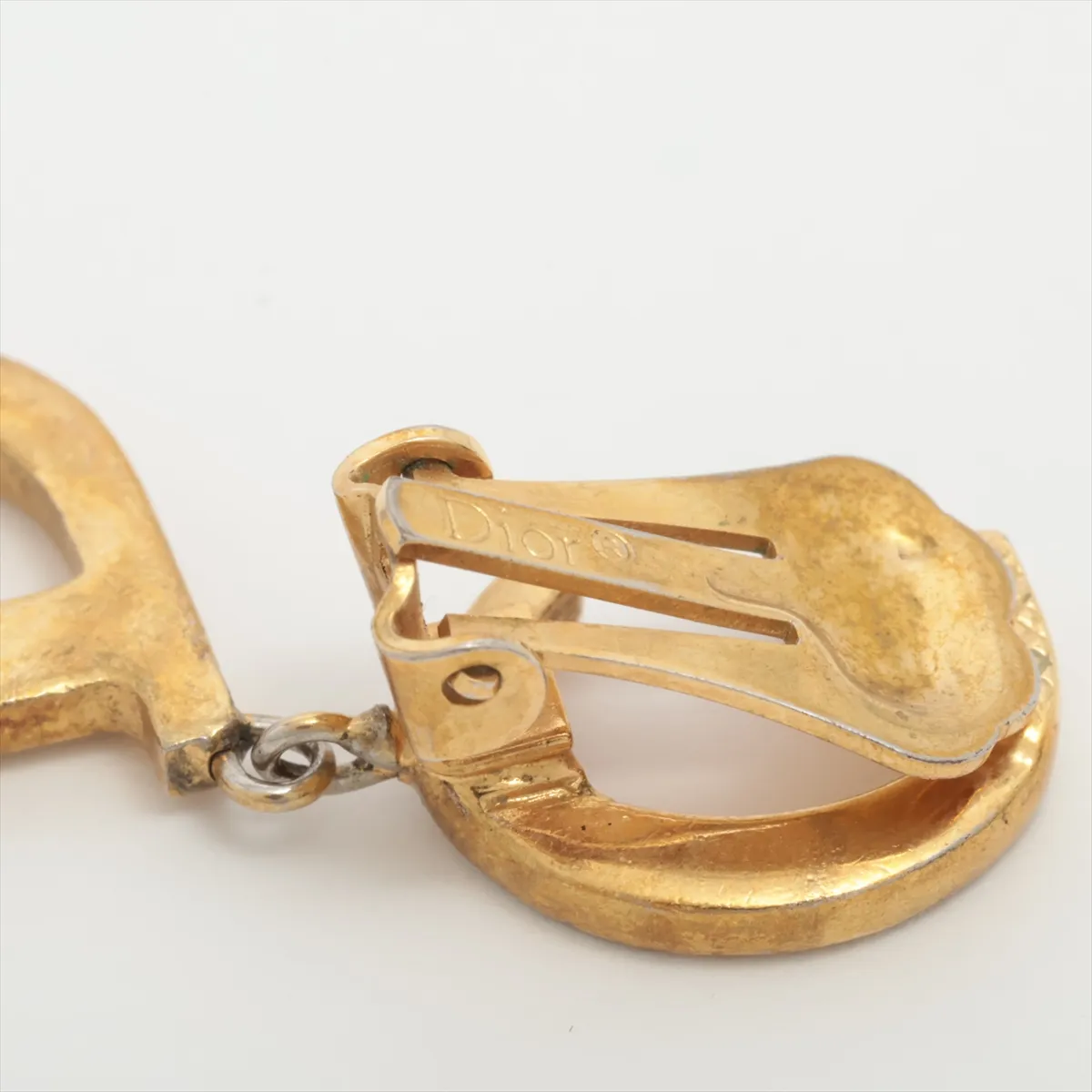 CD logo earrings (for both ears), gold-plated with rhinestones. Shows signs of wear including dents, — view 5
