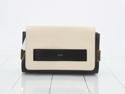 Other lines: Bags and clutch pouches, white/black