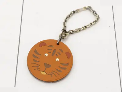 Lion charm, brown leather