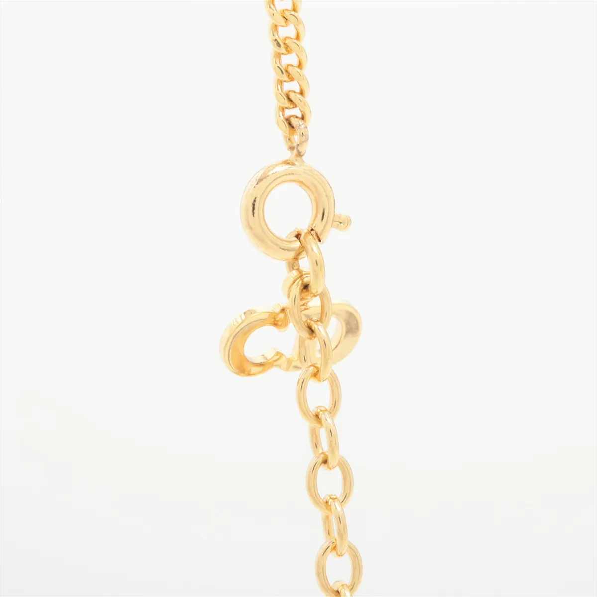 CD logo necklace, gold plated with rhinestones. Shows signs of wear, including — view 3