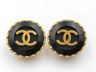 earrings with box, gold and black button design.