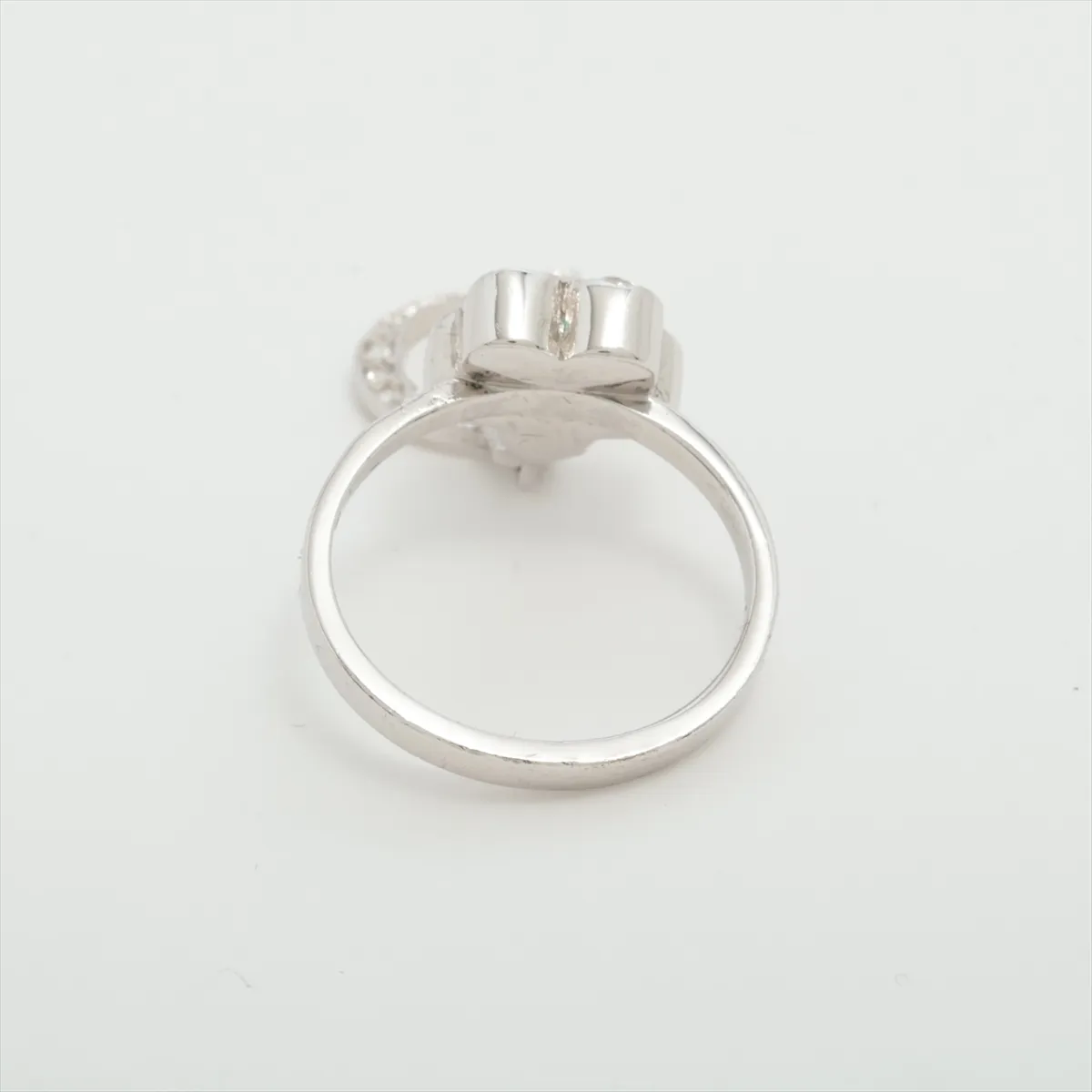 D-logo ring, metal with rhinestones, silver. Shows dents, — view 2