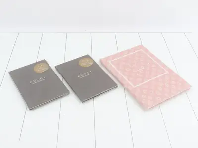 Unused Gucci novelty notebooks, set of 3.