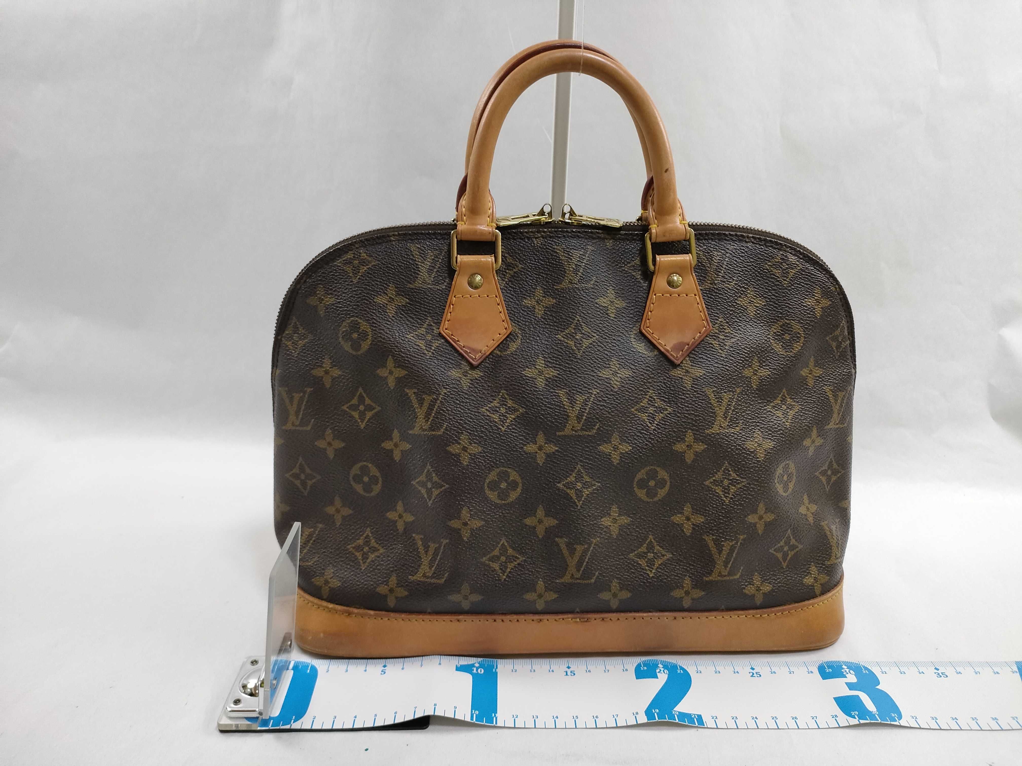 Monogram Louis Vuitton Alma and other handbags — view 2