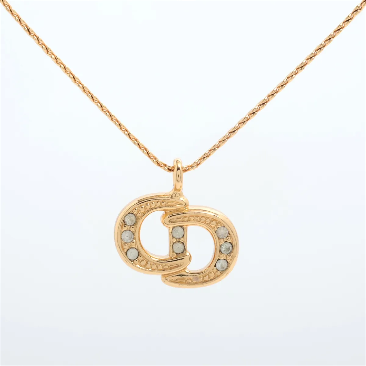 CD logo necklace, gold plated with rhinestones. Shows signs of wear, — view 2