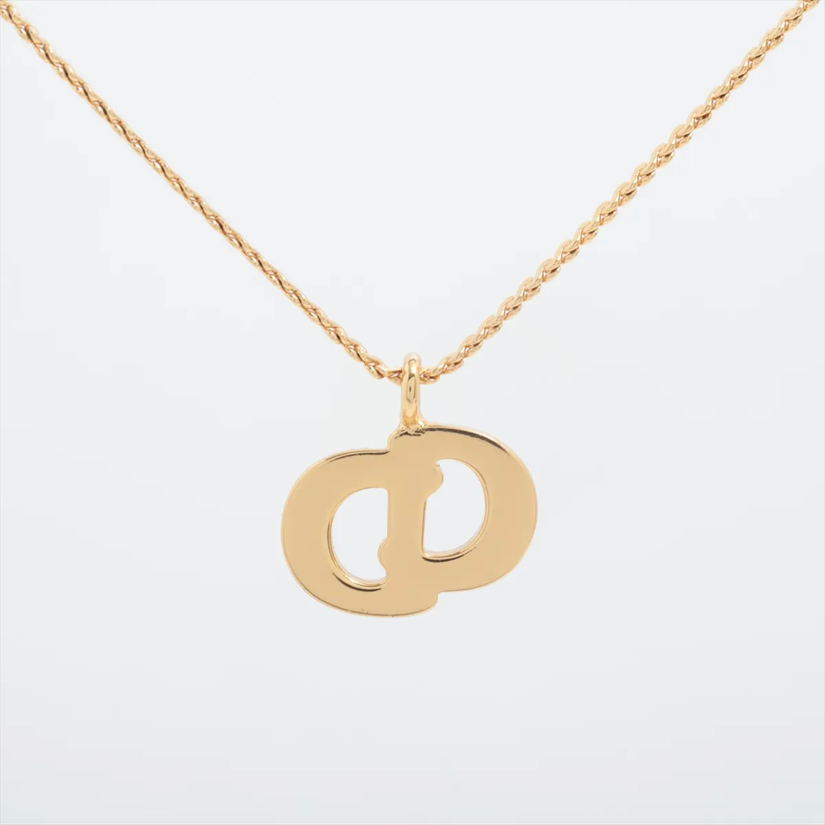CD logo necklace, gold plated with rhinestones. Shows signs of wear, — view 3
