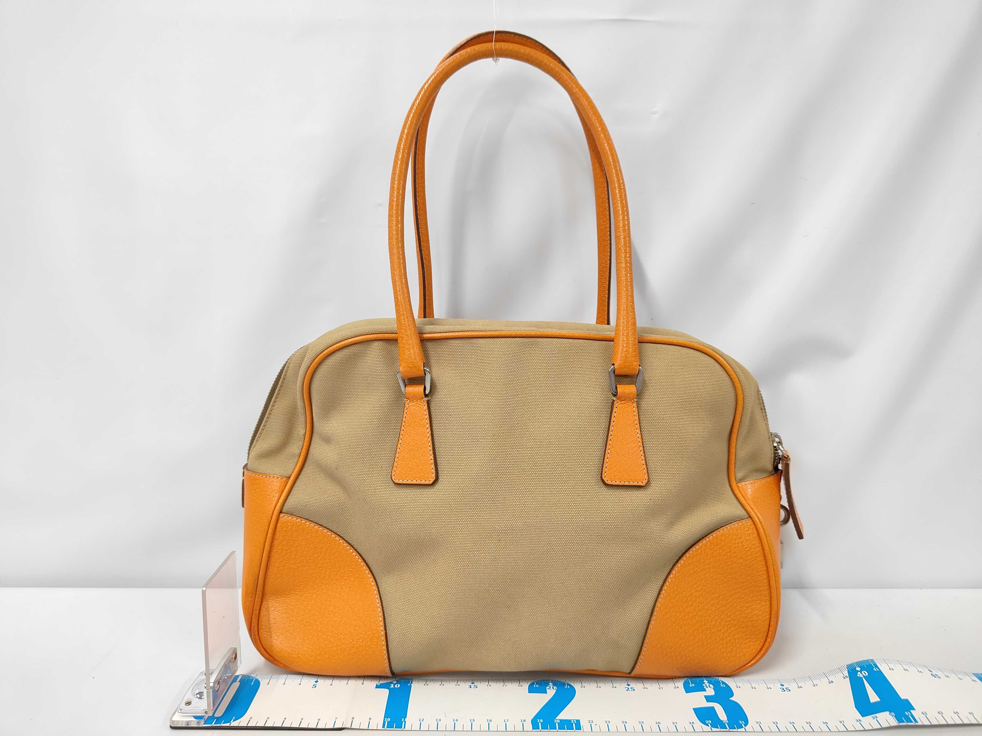 handbag, includes guarantee card, padlock, keys, and name tag. Tote bag. — view 2
