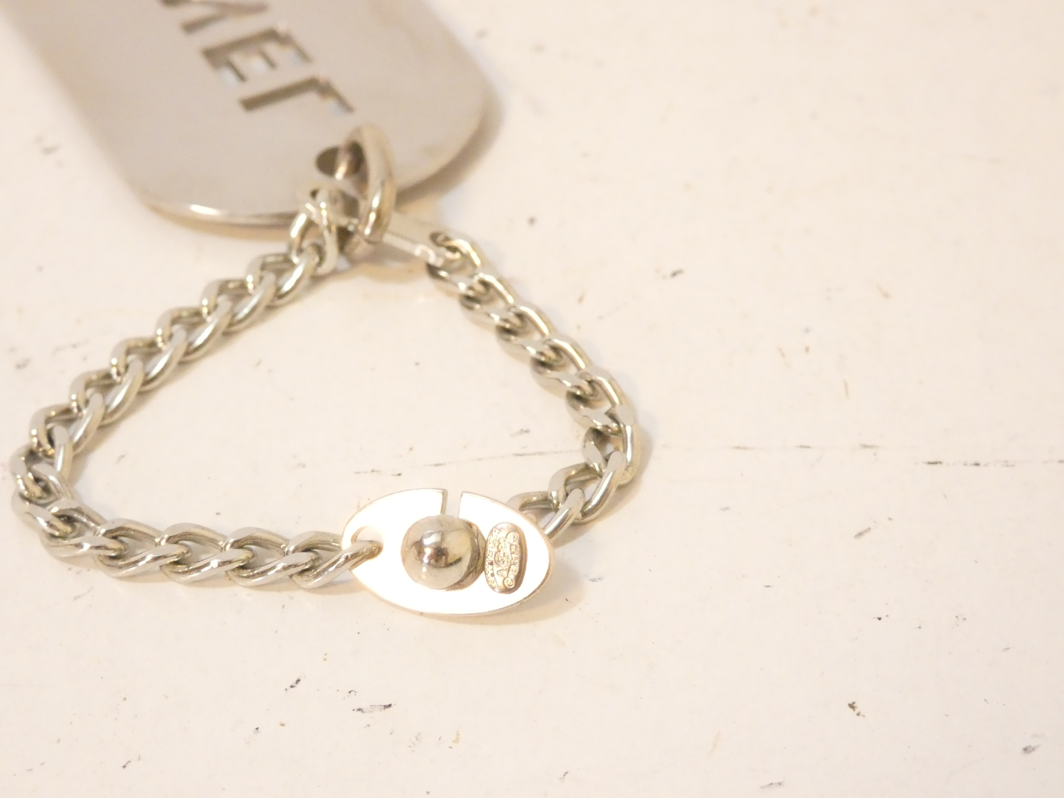 logo punched silver keychain charm — view 3