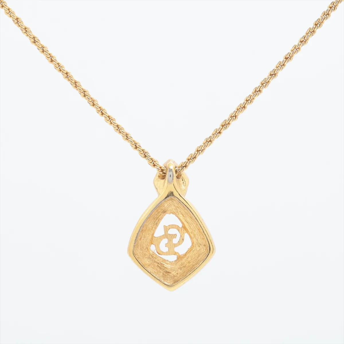 CD logo necklace, gold plated with rhinestones. Shows signs of wear, — view 2