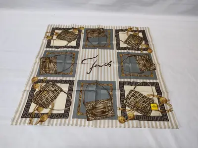 Zucca Zucchino Pecan bag, chain print handkerchief, and other accessories.