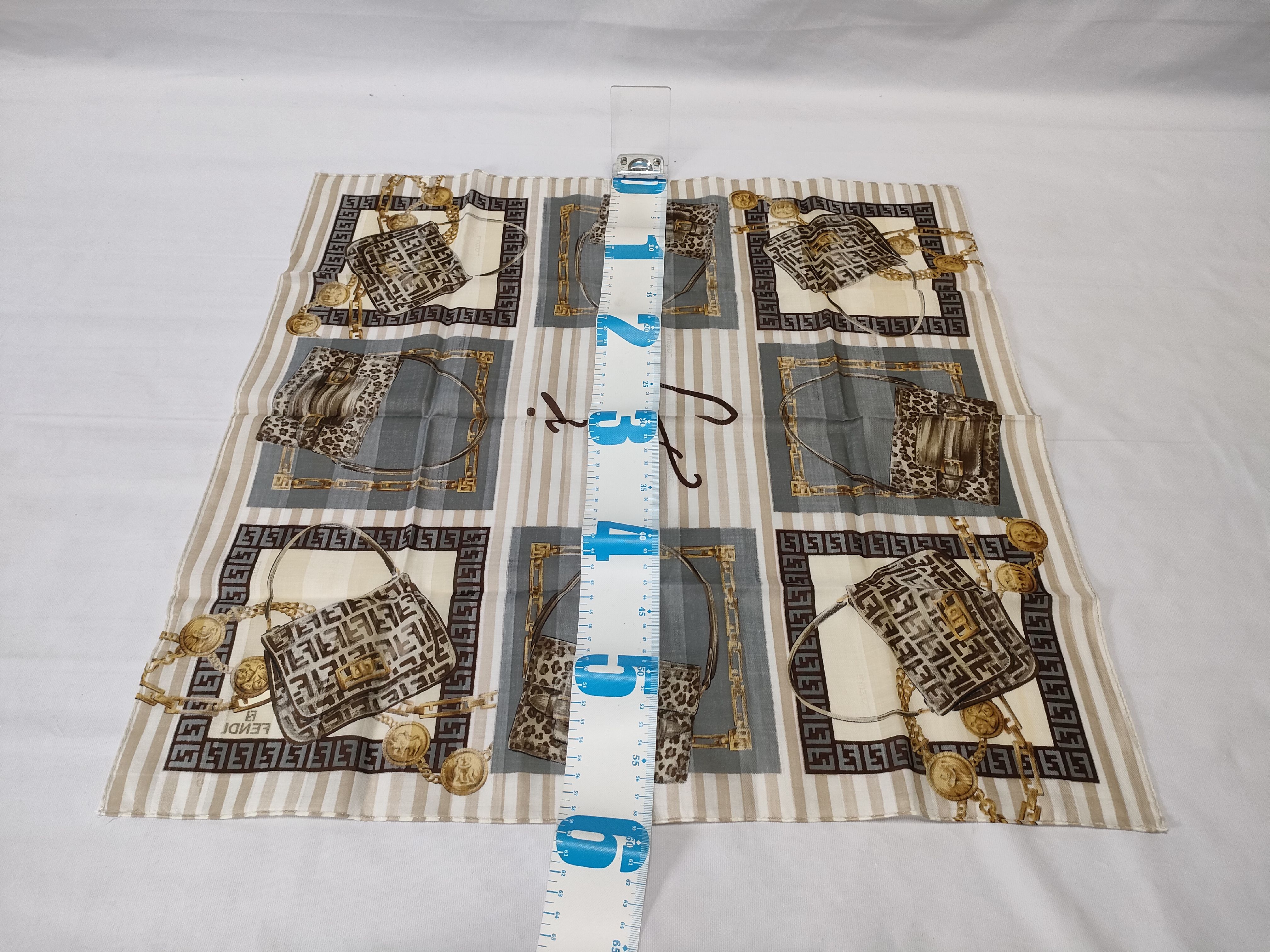 Zucca Zucchino Pecan bag, chain print handkerchief, and other accessories. — view 2