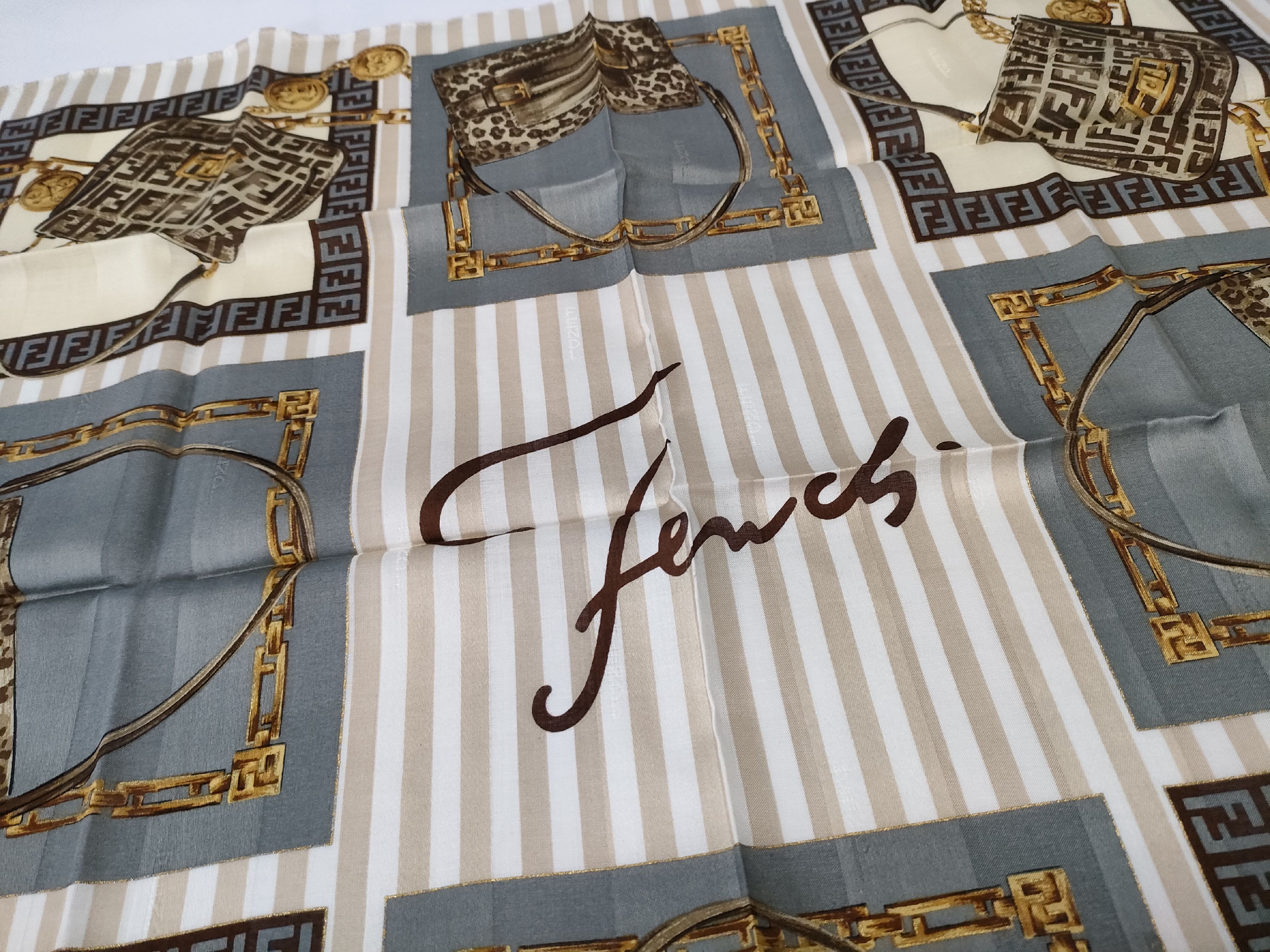 Zucca Zucchino Pecan bag, chain print handkerchief, and other accessories. — view 5