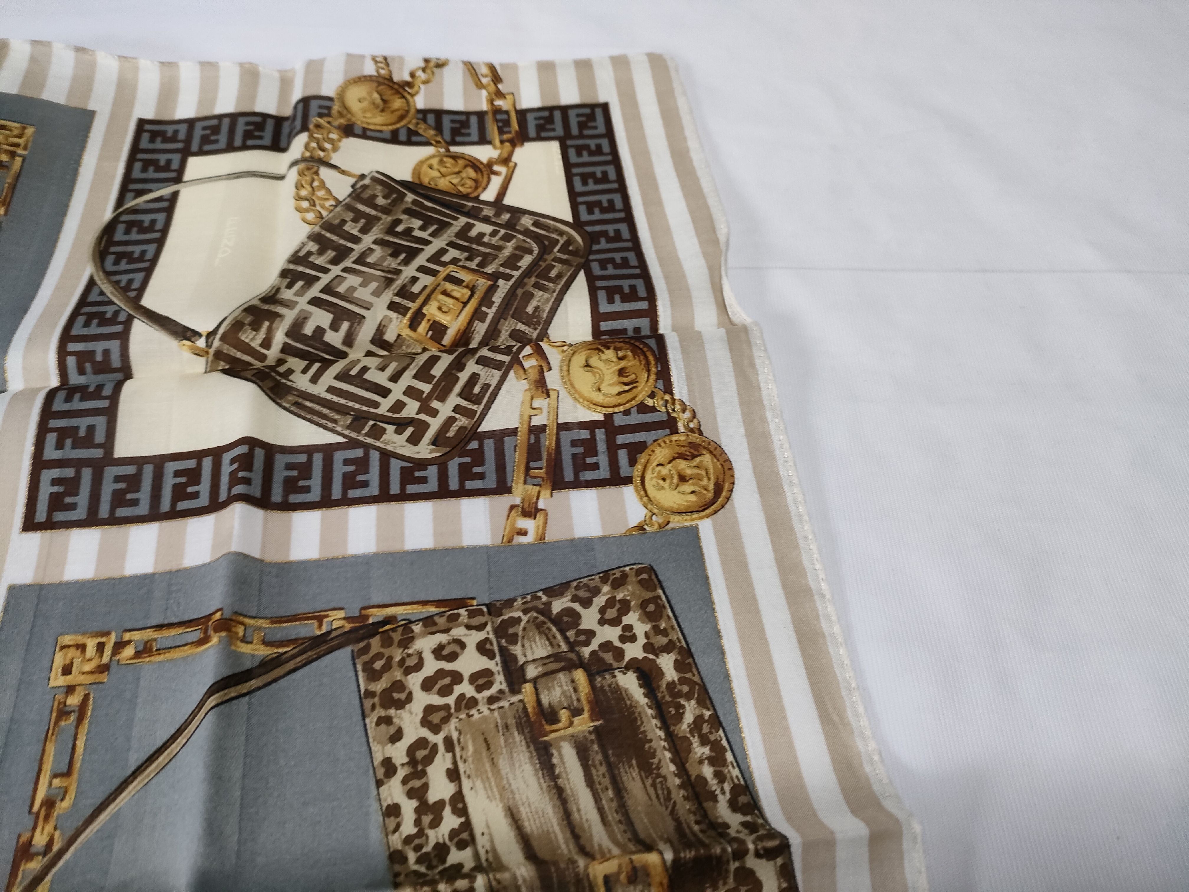 Zucca Zucchino Pecan bag, chain print handkerchief, and other accessories. — view 6