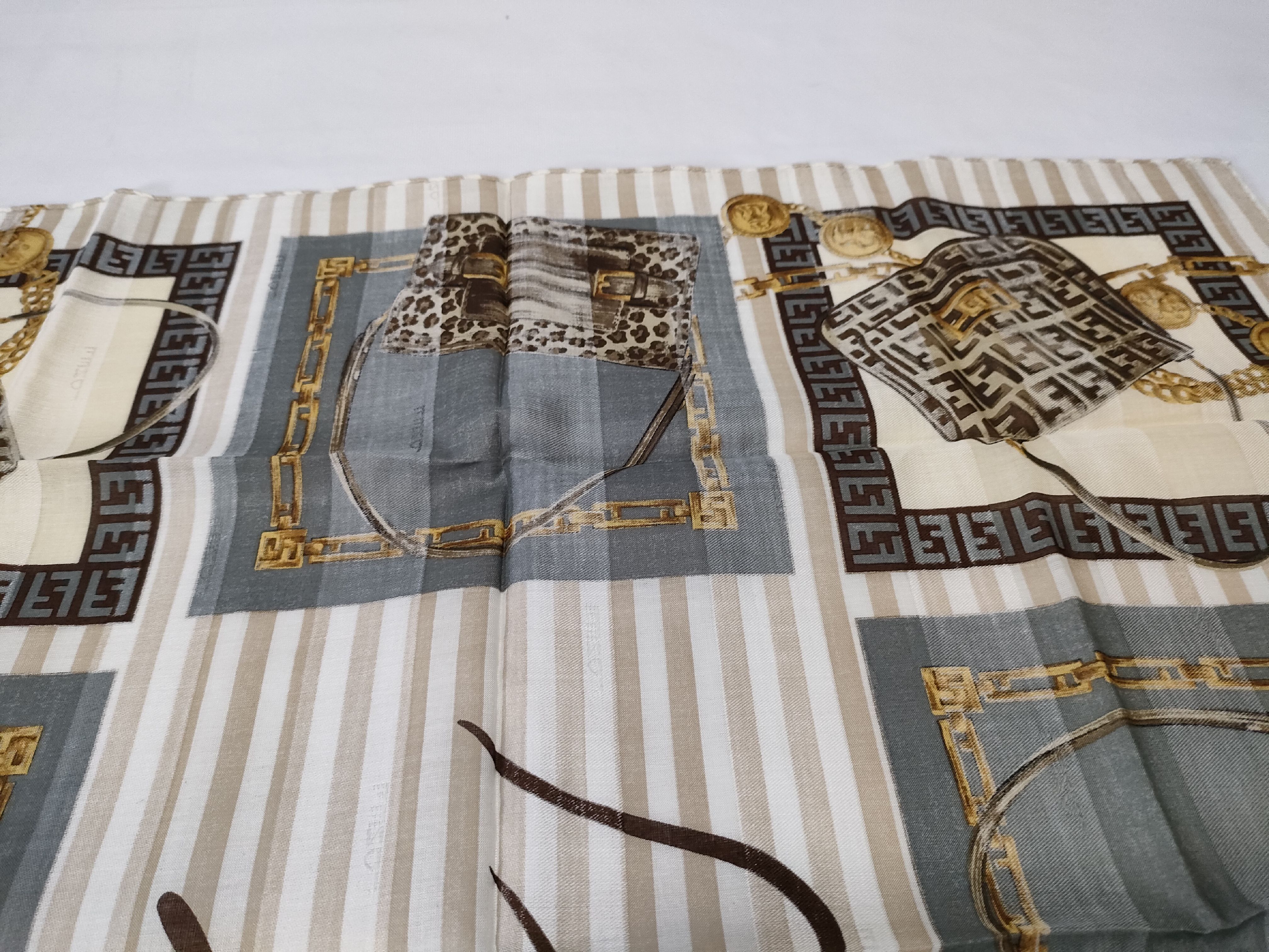 Zucca Zucchino Pecan bag, chain print handkerchief, and other accessories. — view 10