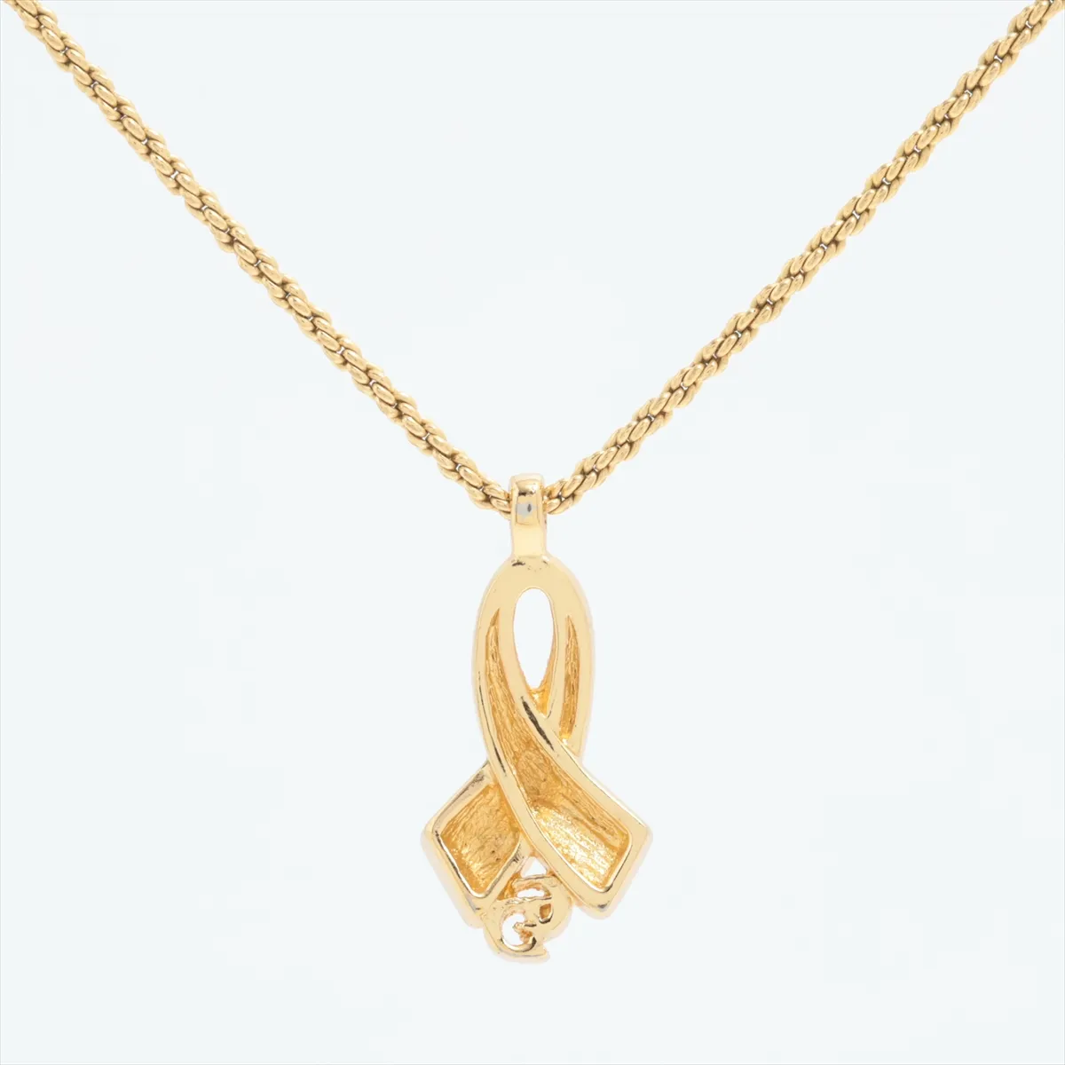 CD logo necklace, gold plated with rhinestones. Shows signs of wear, — view 2