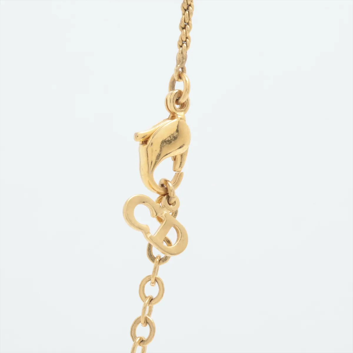 CD logo necklace, gold plated with rhinestones. Shows signs of wear, — view 3