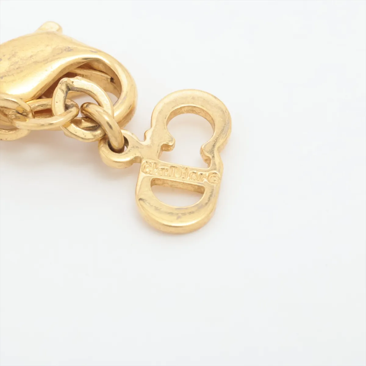 CD logo necklace, gold plated with rhinestones. Shows signs of wear, — view 4