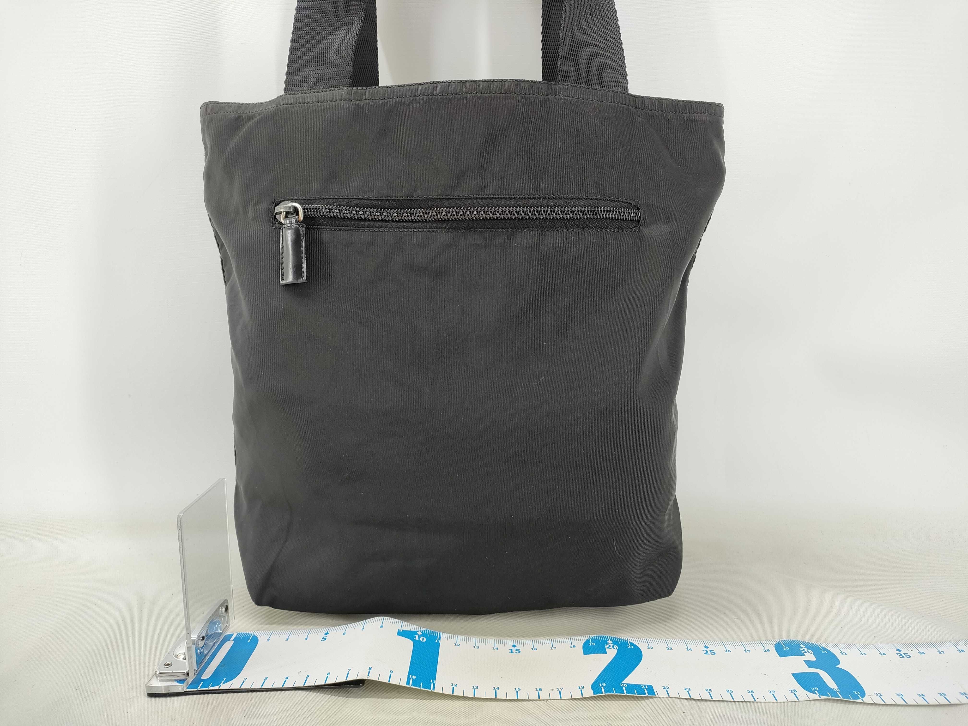nylon tote bag, black, with zipper and white tag, size 25. — view 2