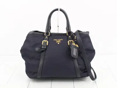 nylon navy handbag with triangular logo.