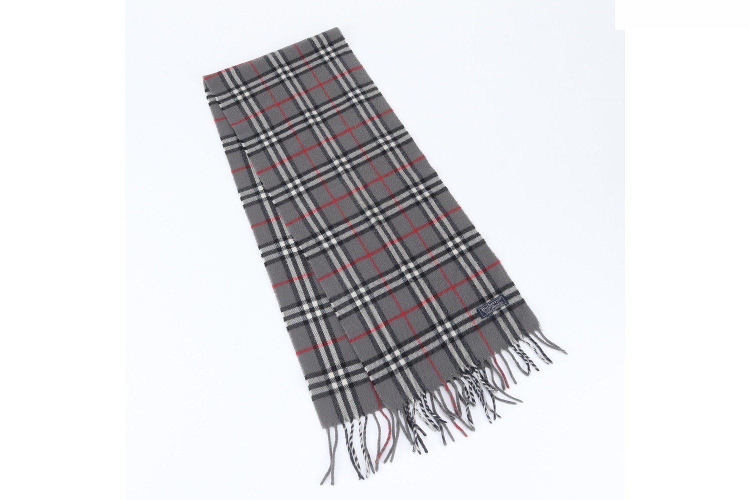 Nova Check scarf with tags attached.
